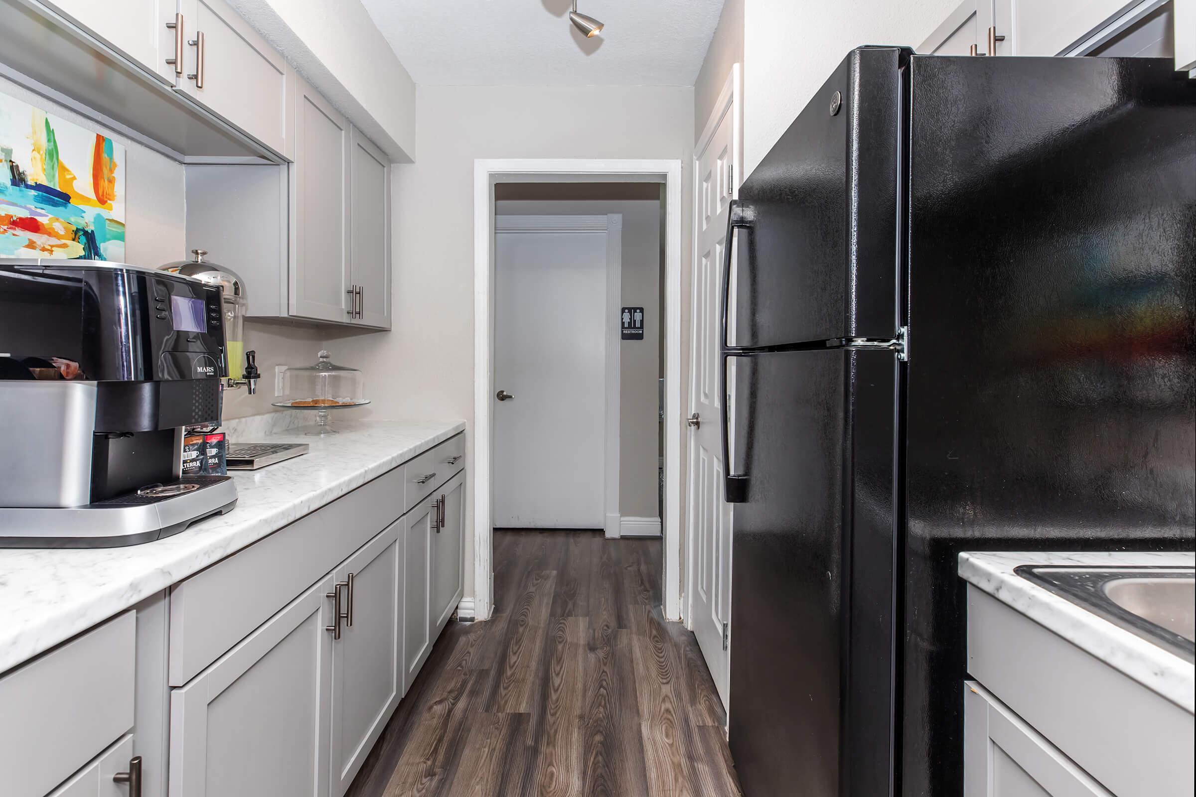 a stainless steel refrigerator in a kitchen