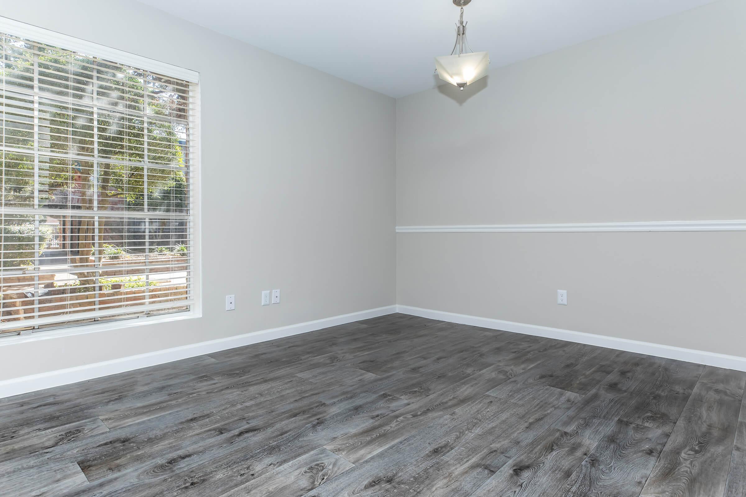 a bedroom with a large window