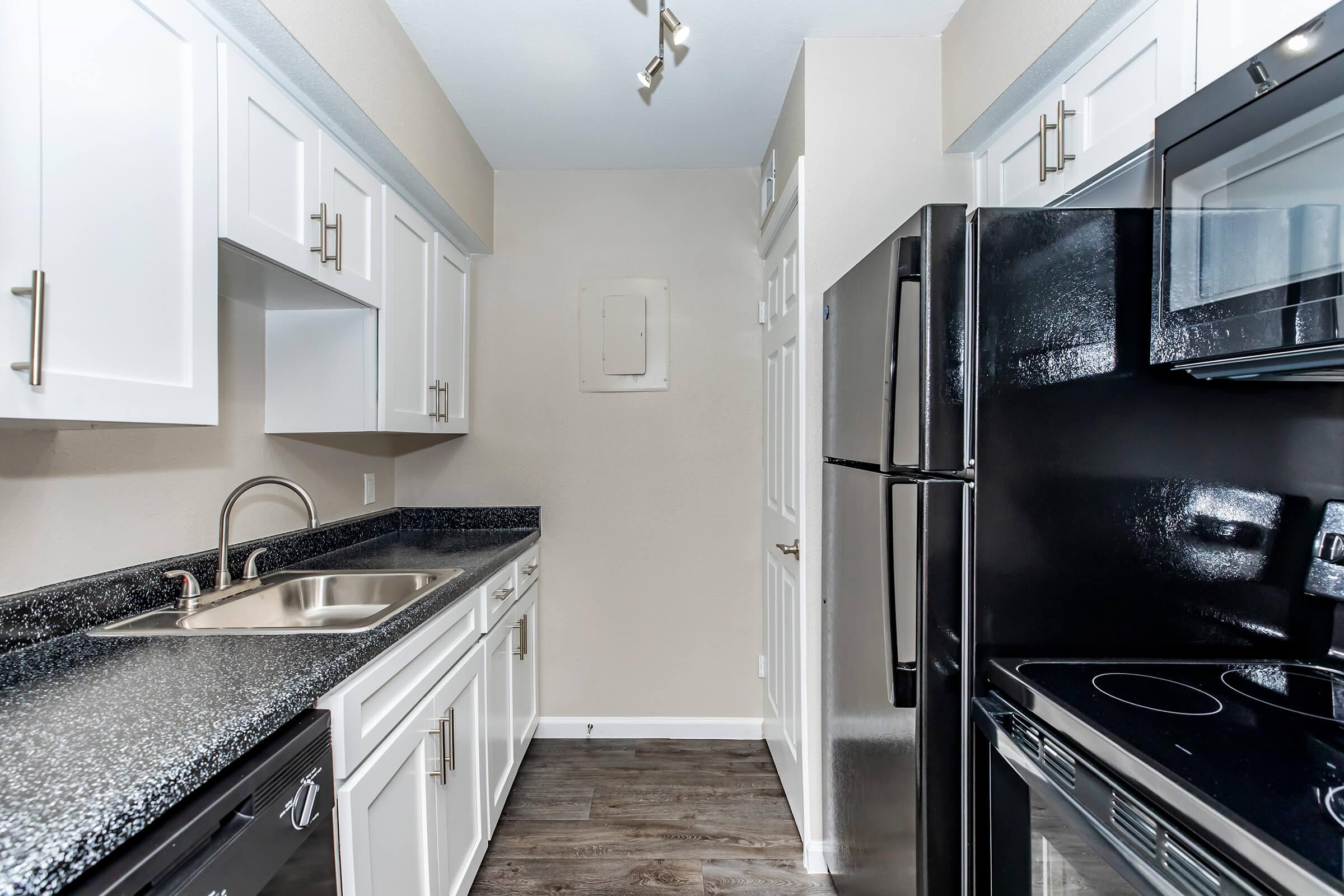 a modern kitchen with stainless steel appliances