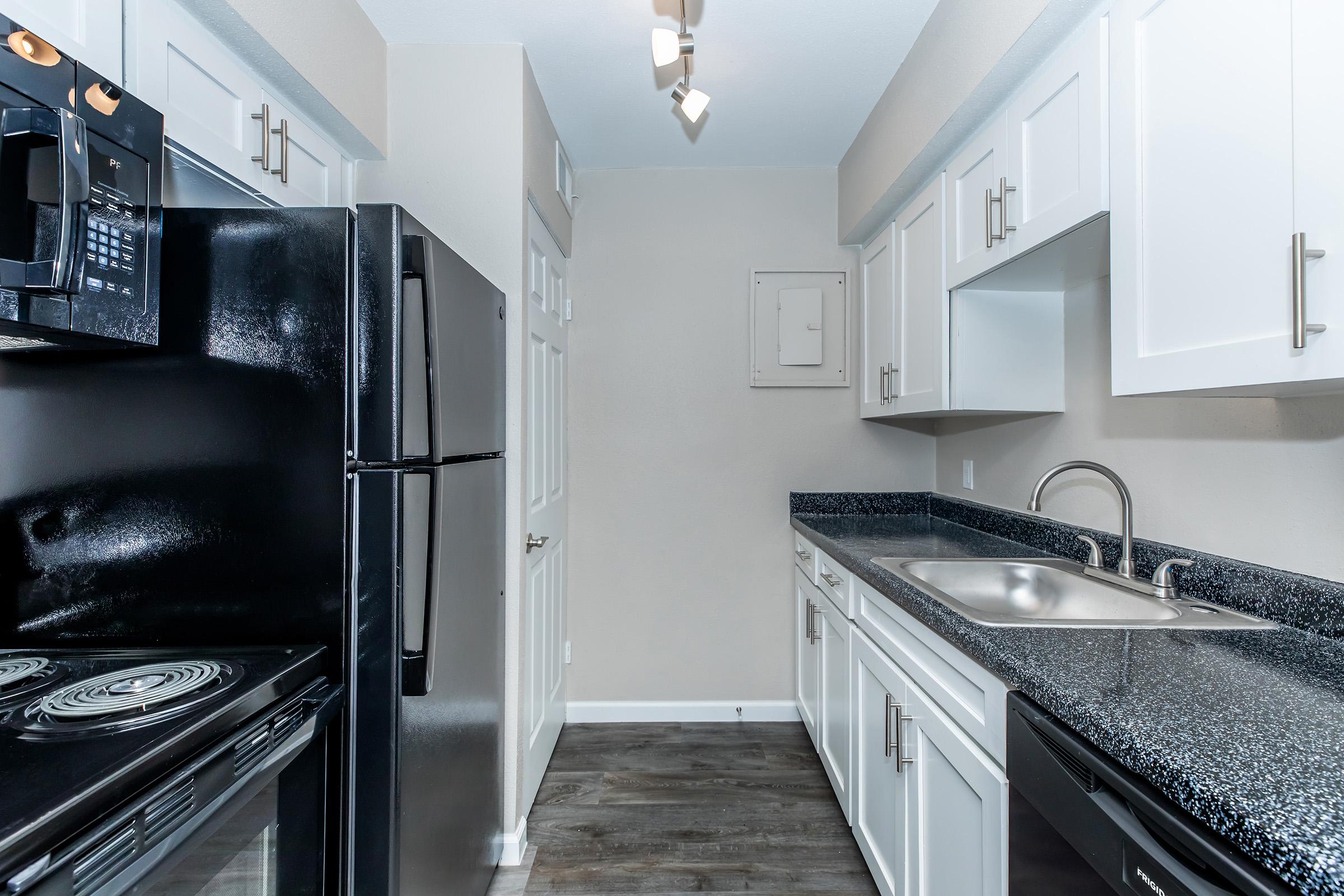 a modern kitchen with stainless steel appliances