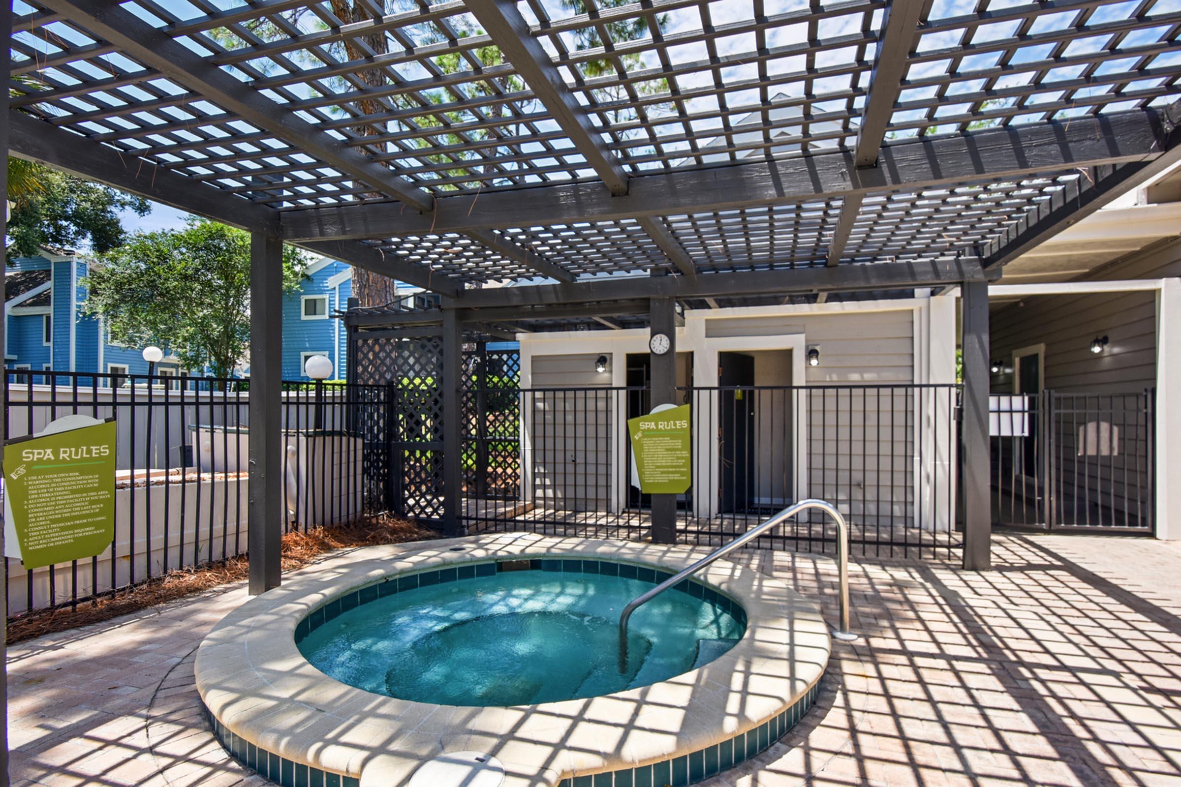 a room with a pool in front of a building