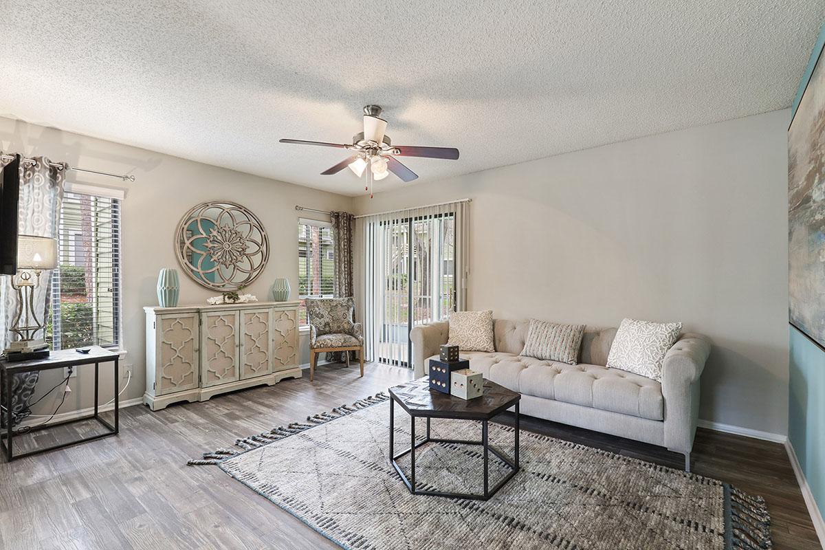 a living room filled with furniture and a fireplace