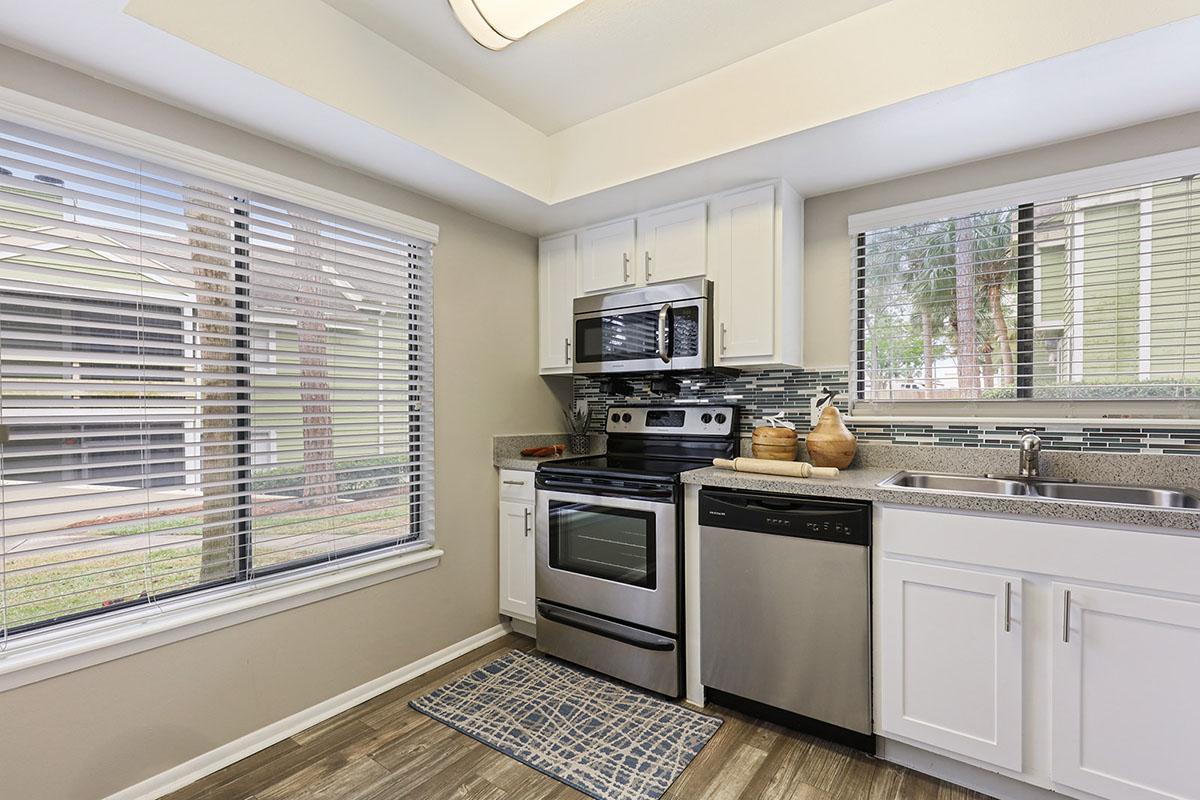 a modern kitchen with stainless steel appliances