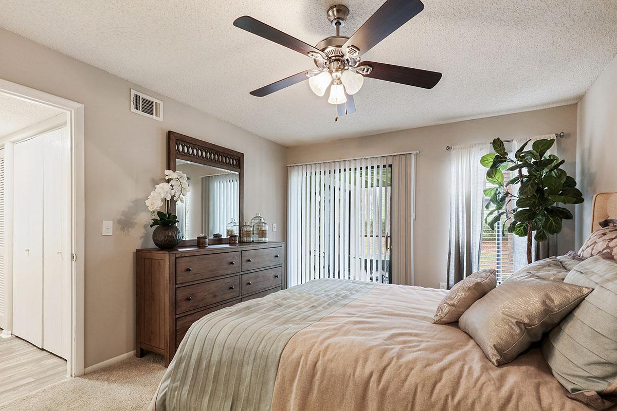 a bedroom with a large bed in a room