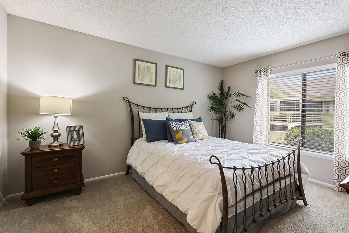 a bedroom with a large bed in a hotel room