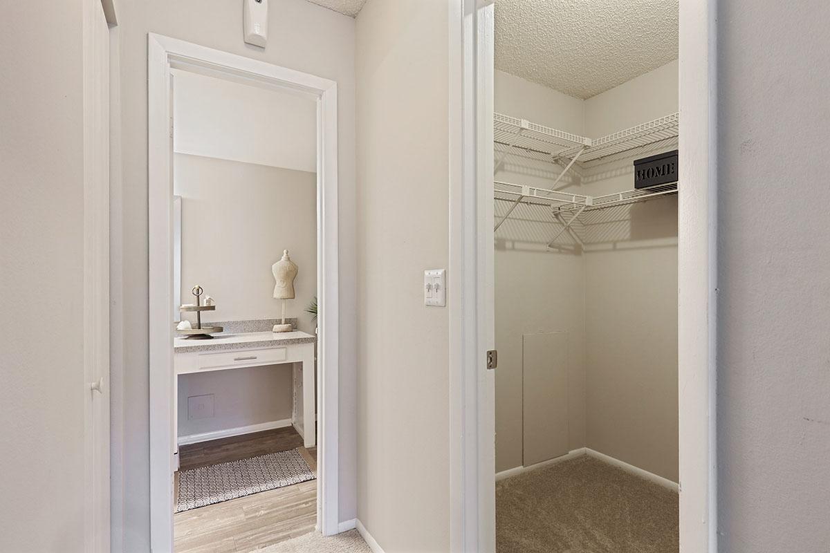 a white sink sitting under a window