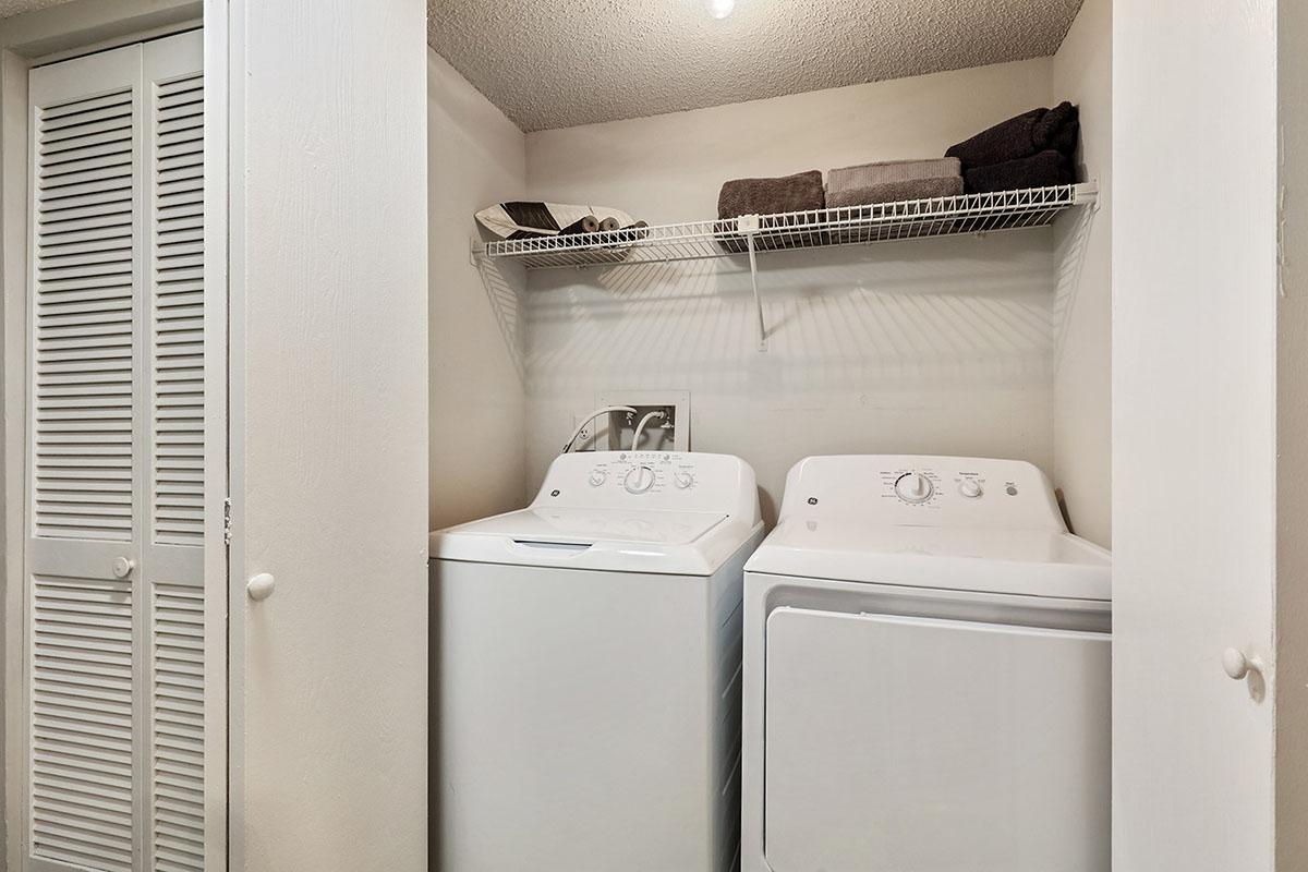 a white refrigerator freezer sitting next to a window