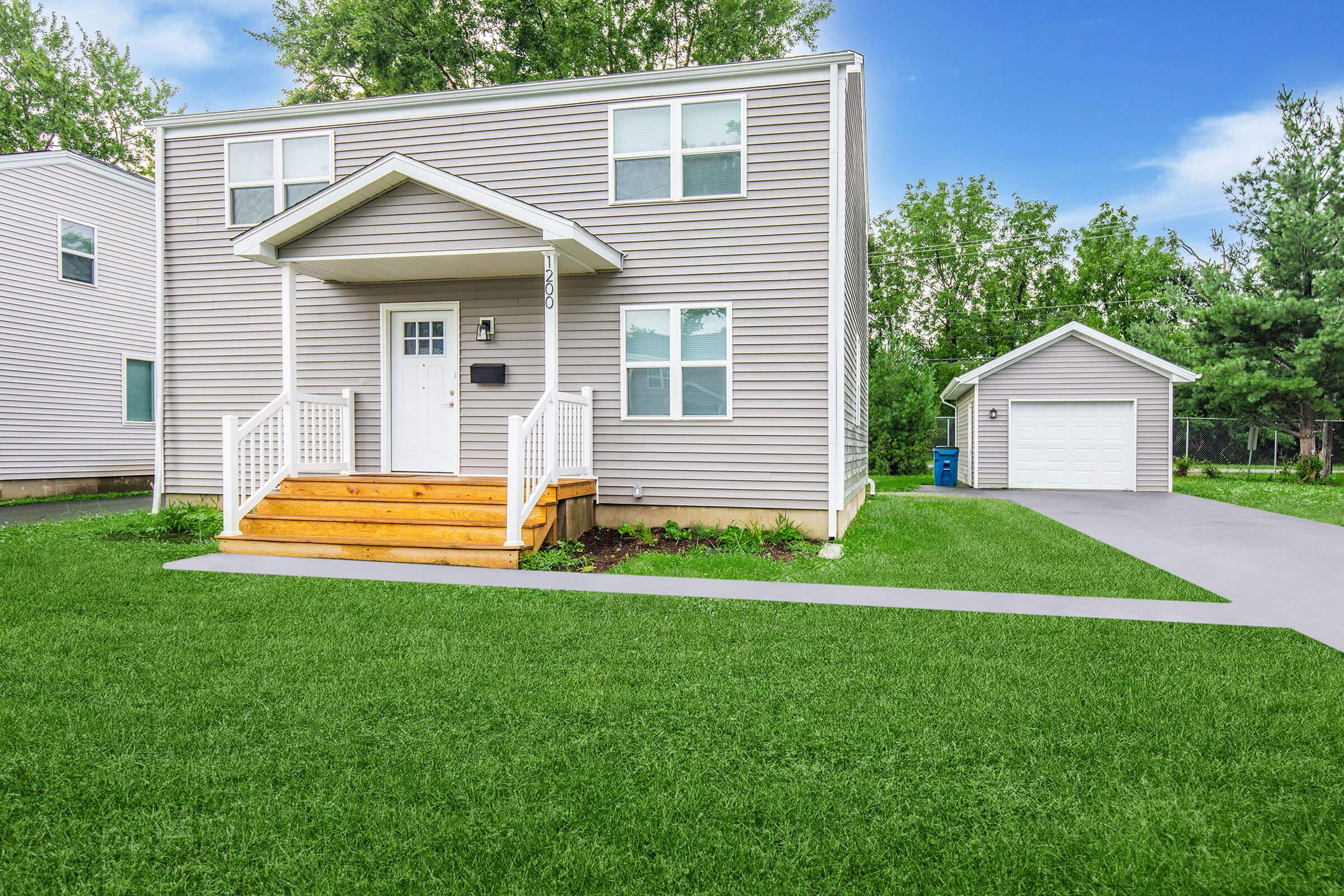 a large lawn in front of a house