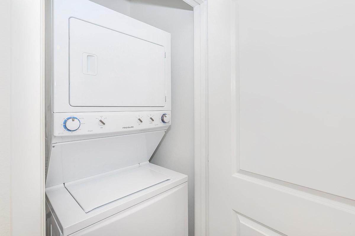 a white refrigerator freezer sitting next to a door