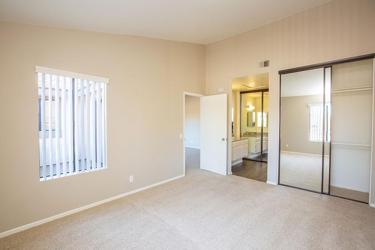 Bedroom with open door to bathroom