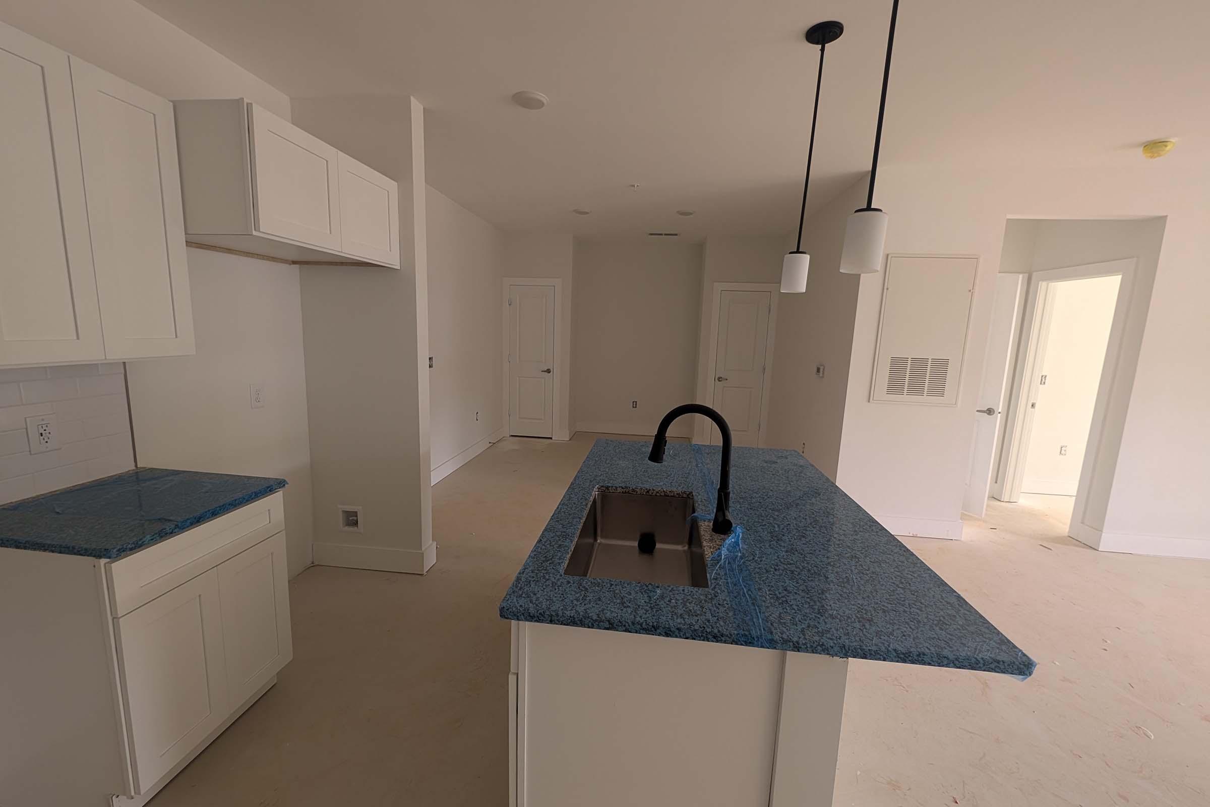 a kitchen with a stove and a sink