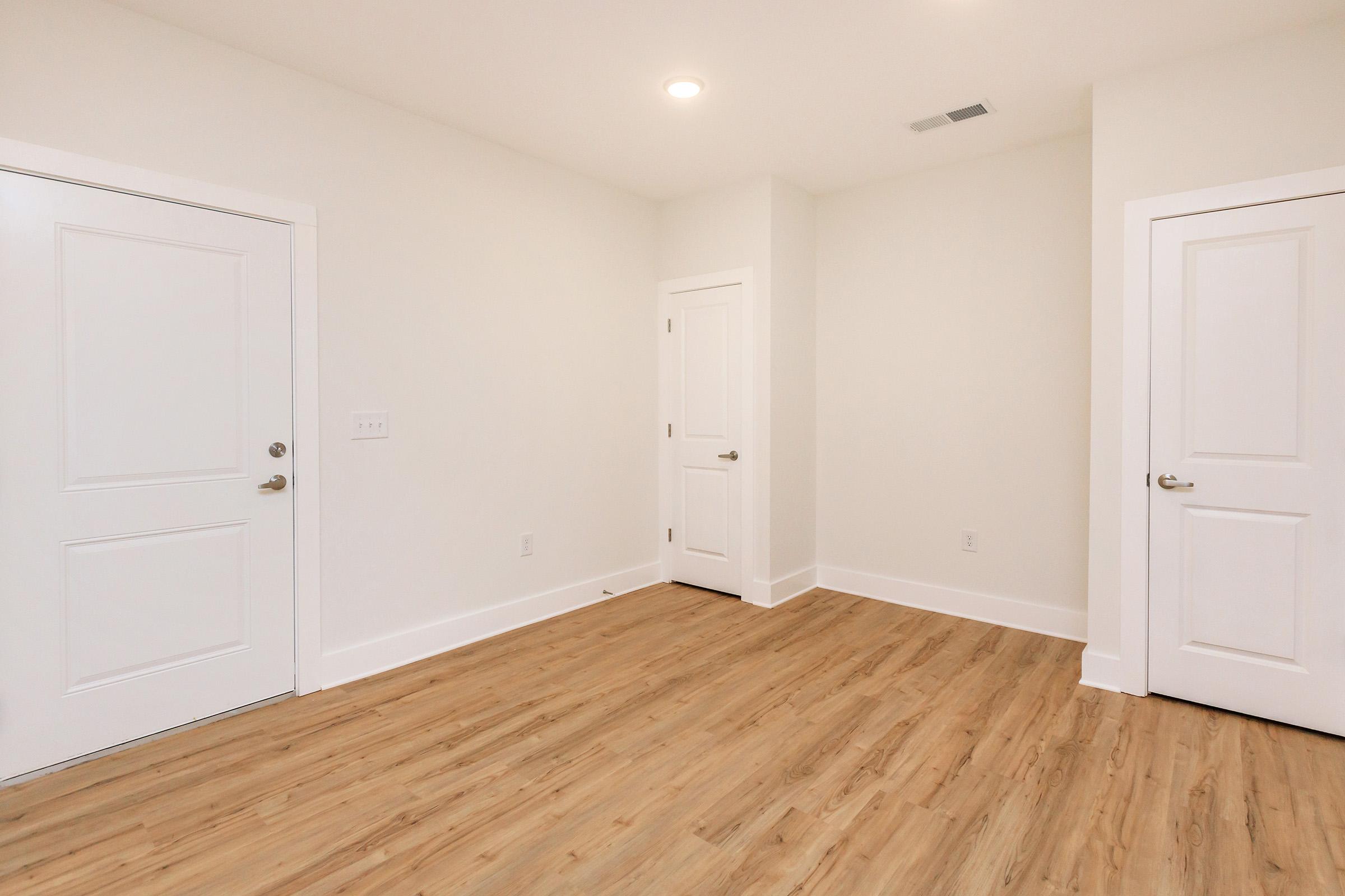 a kitchen with a wood floor