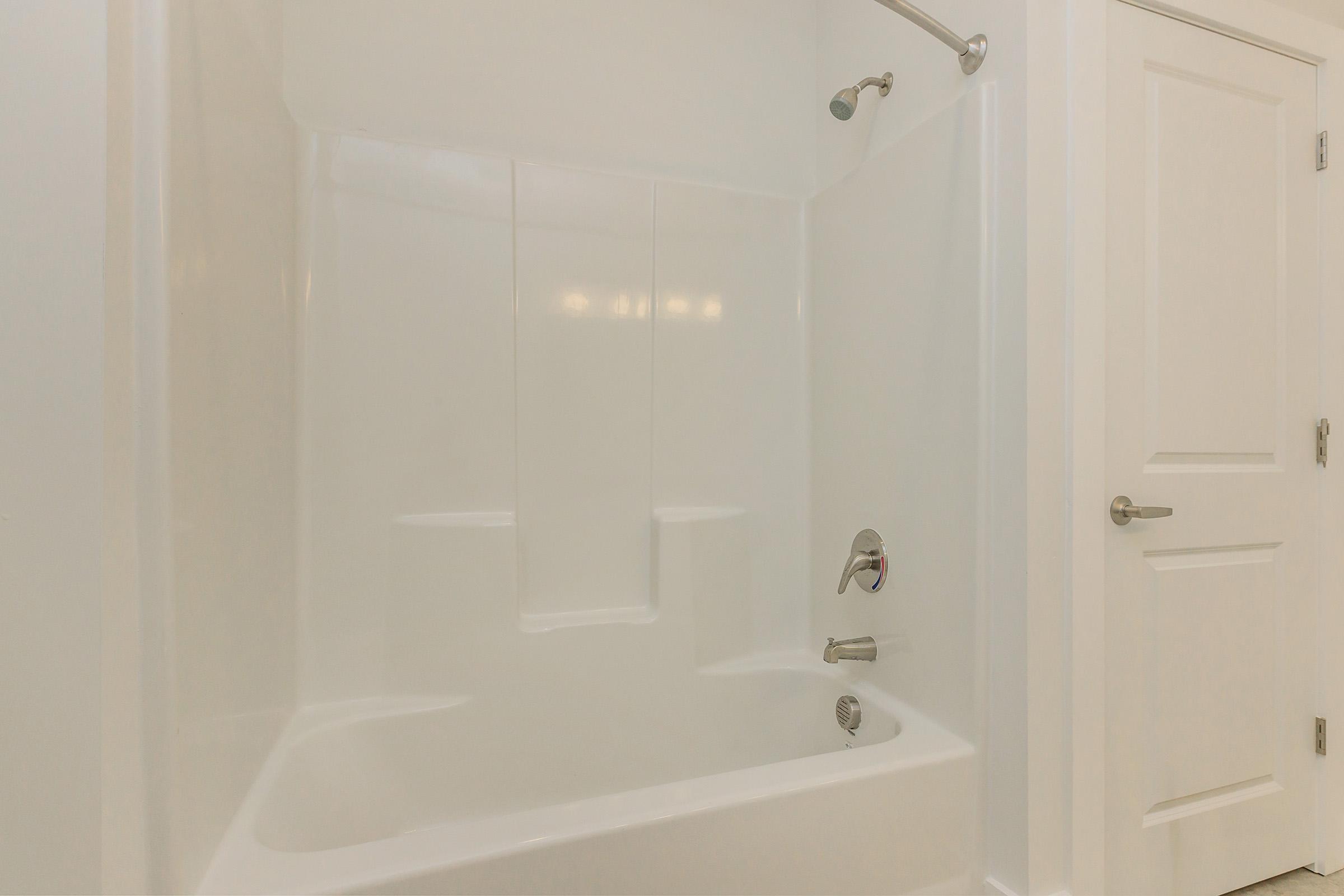 a room with a sink and a bath tub