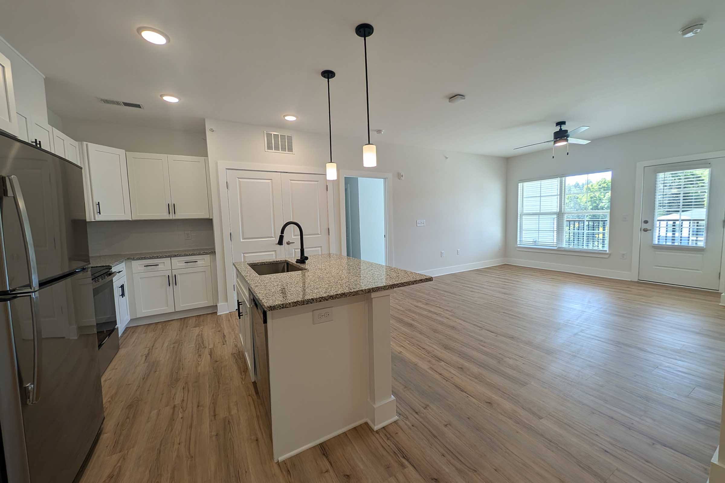 a kitchen with a wood floor