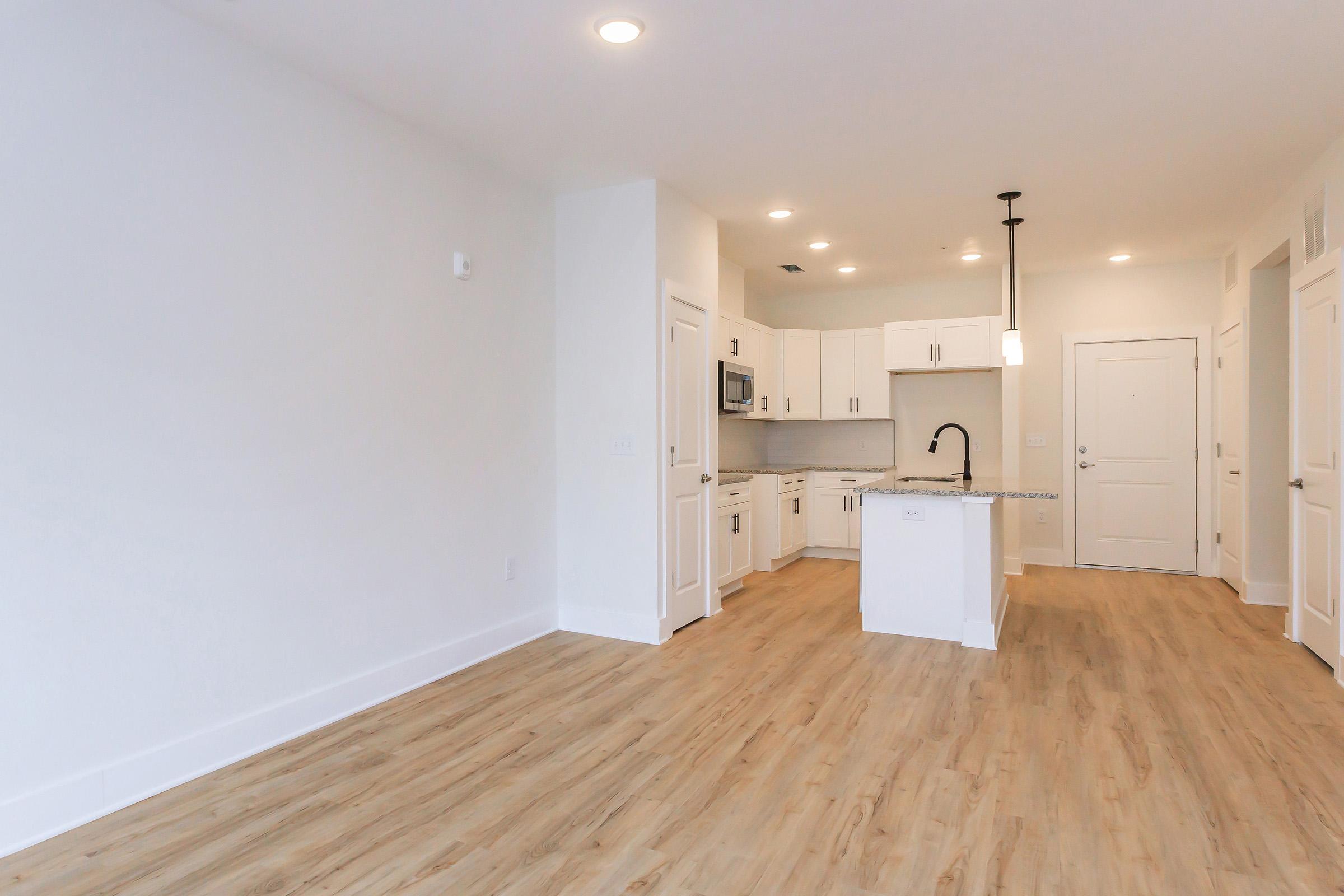 a kitchen with a wood floor