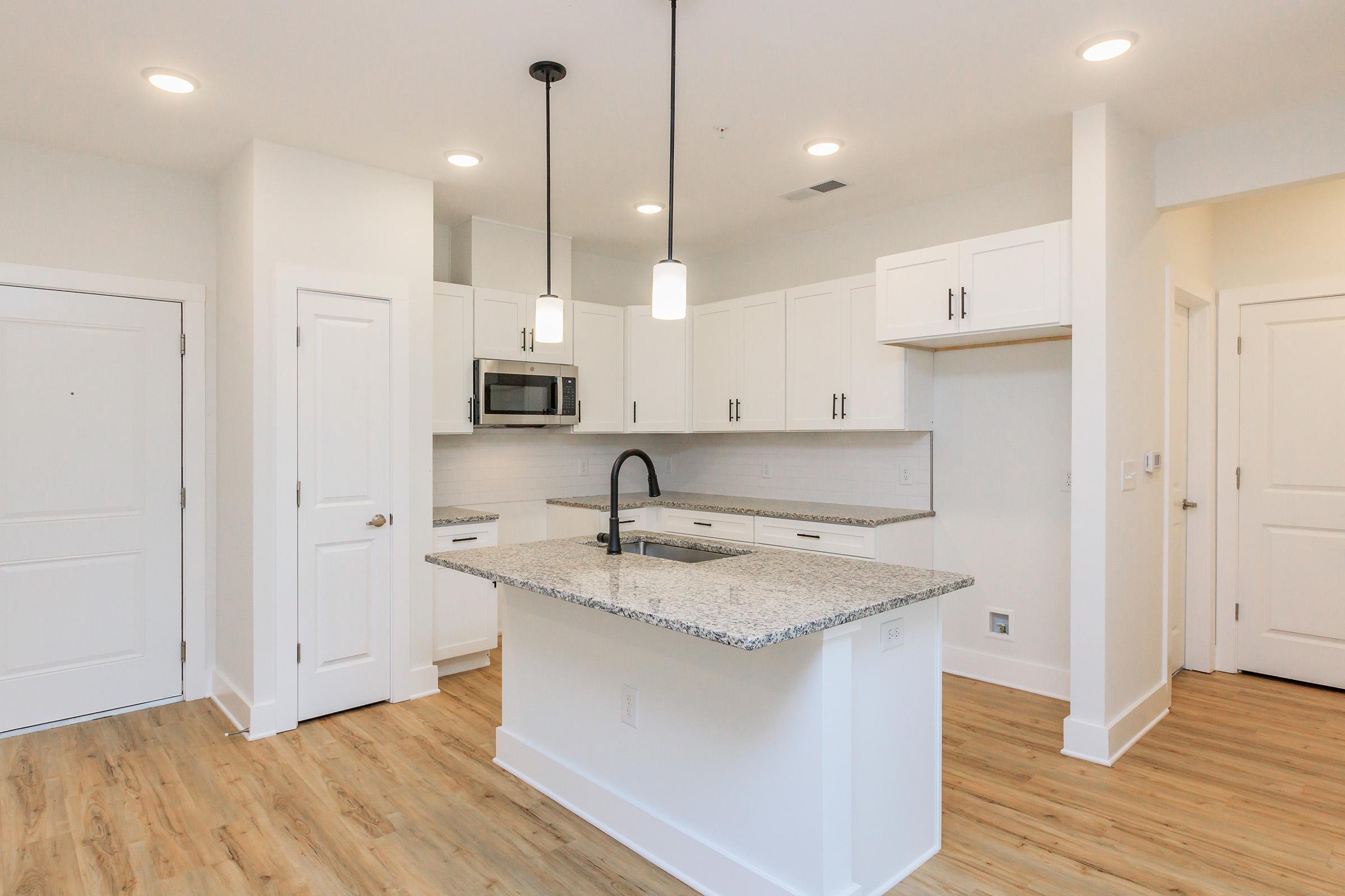 a kitchen with a wood floor