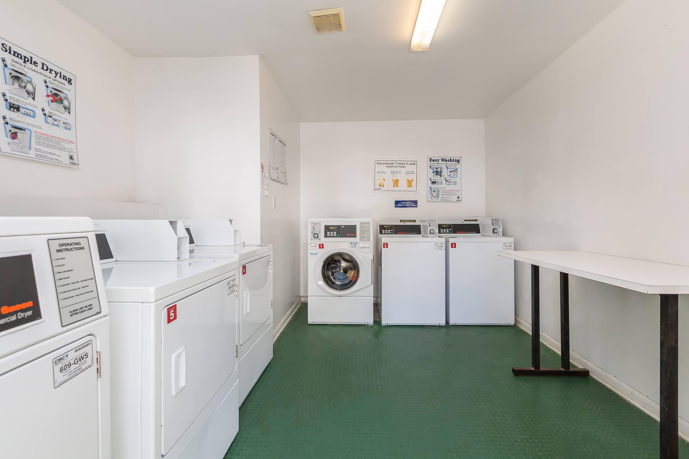 a white refrigerator freezer sitting inside of a kitchen