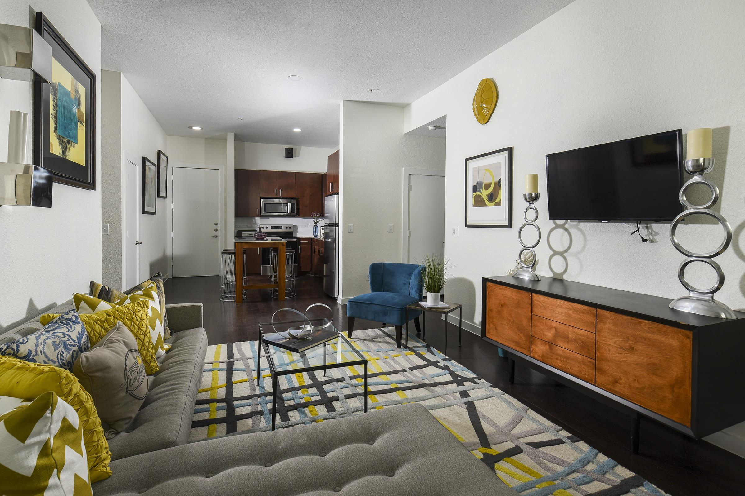 a living room filled with furniture and a mirror