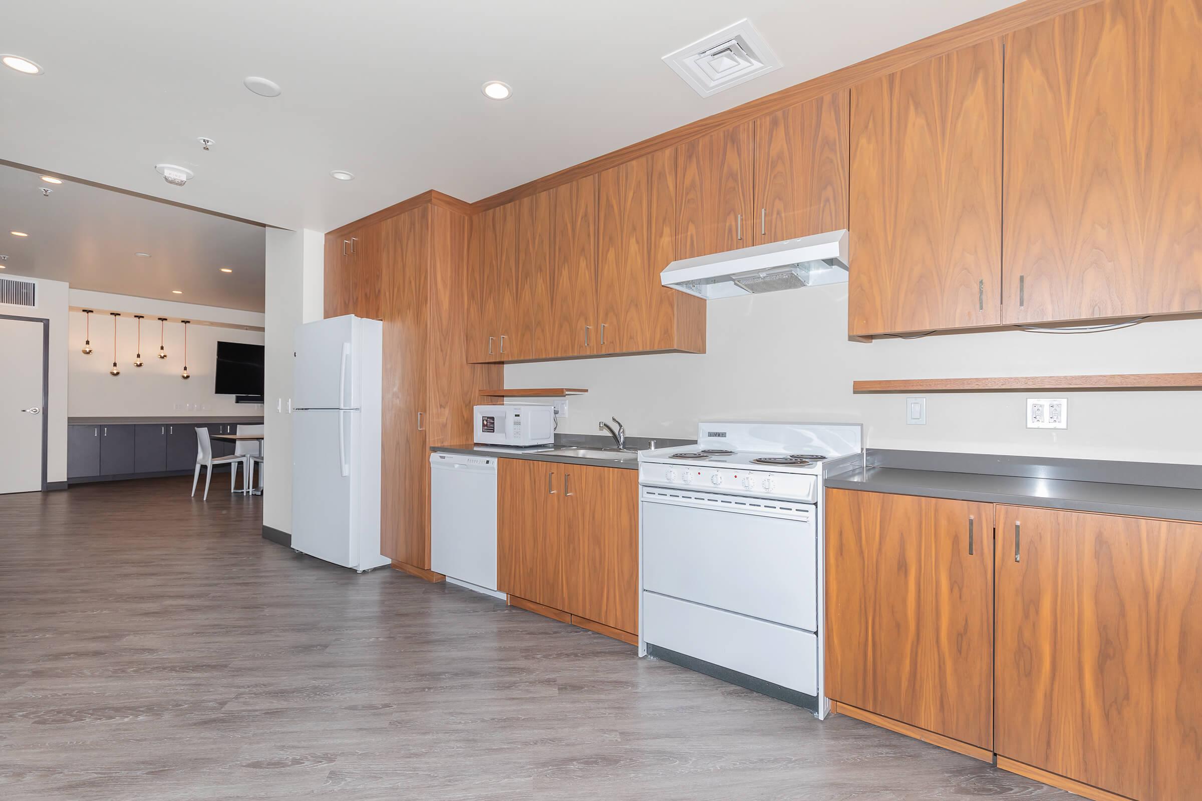 a kitchen with a wood floor