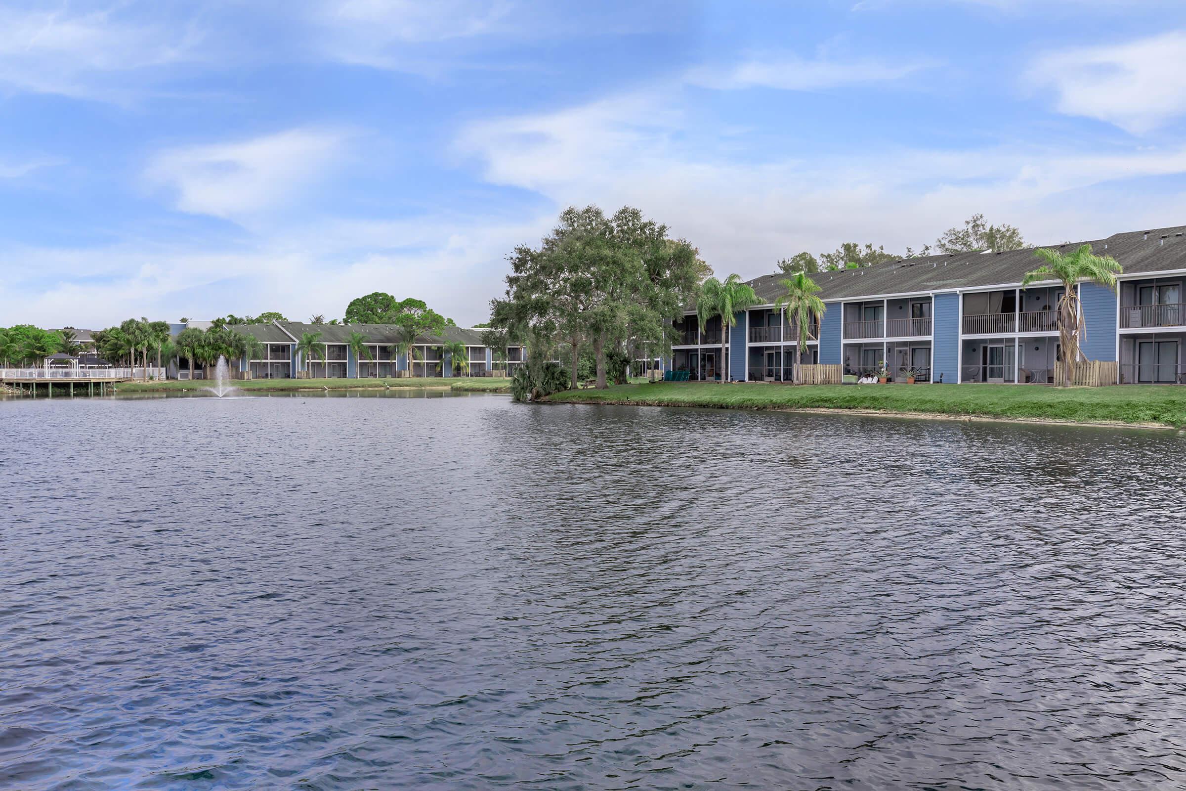 a house next to a body of water