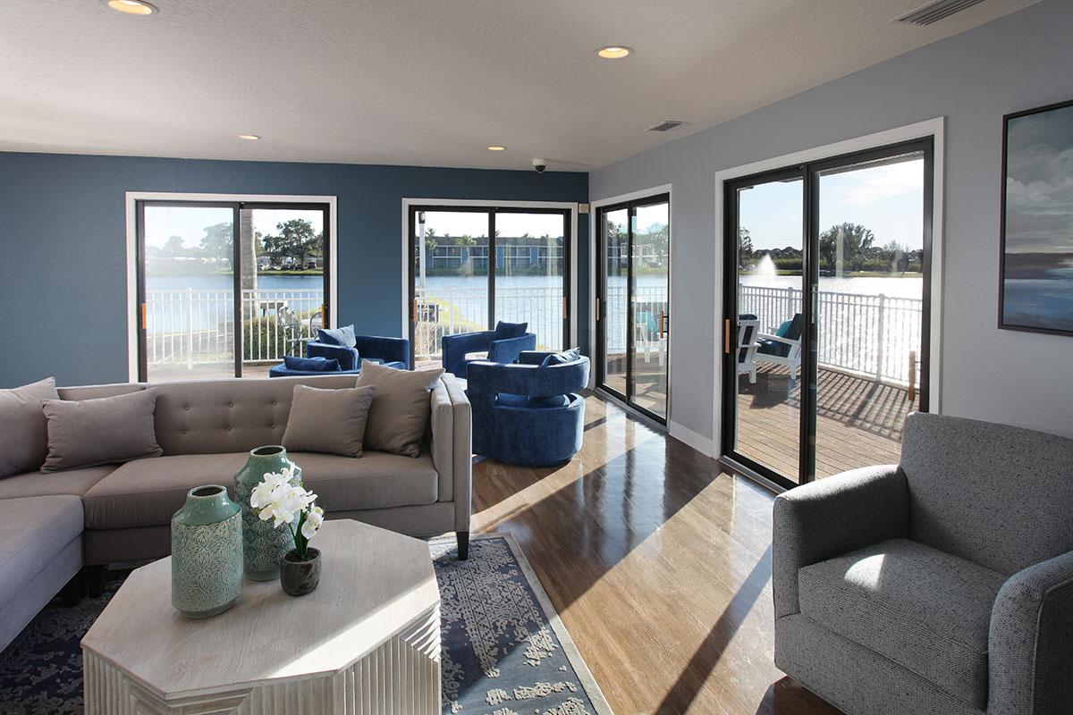 a living room filled with furniture and a flat screen tv