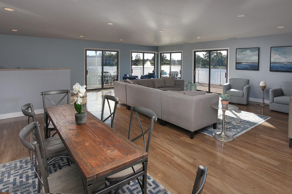 a living room filled with furniture and a large window