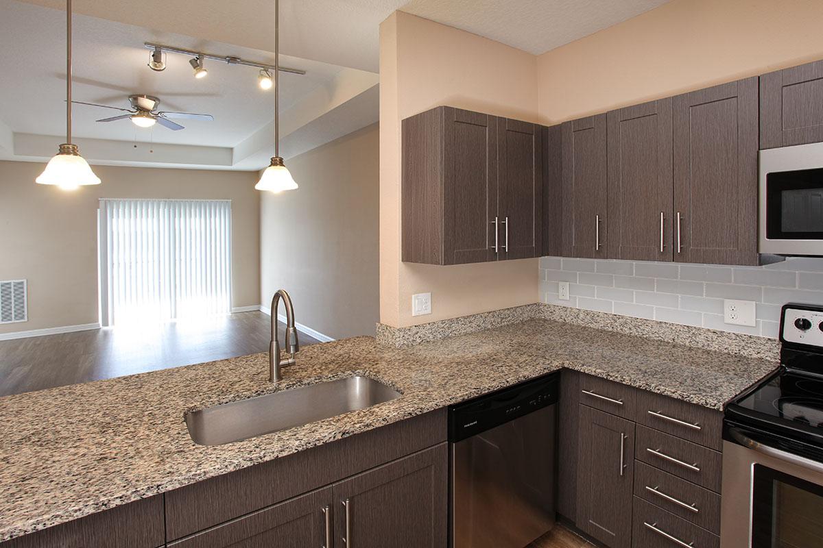 a modern kitchen with stainless steel appliances