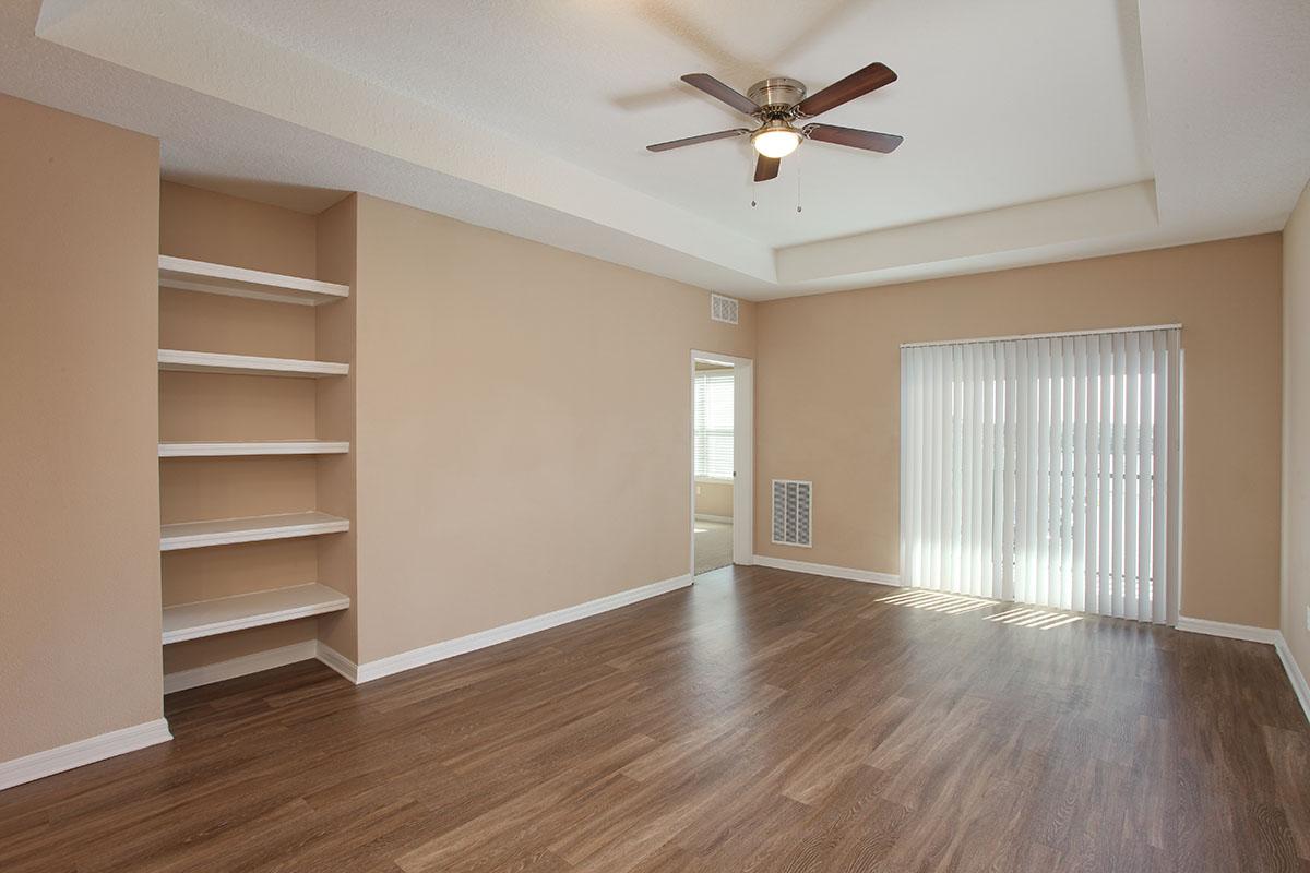 a large empty room with a wood floor