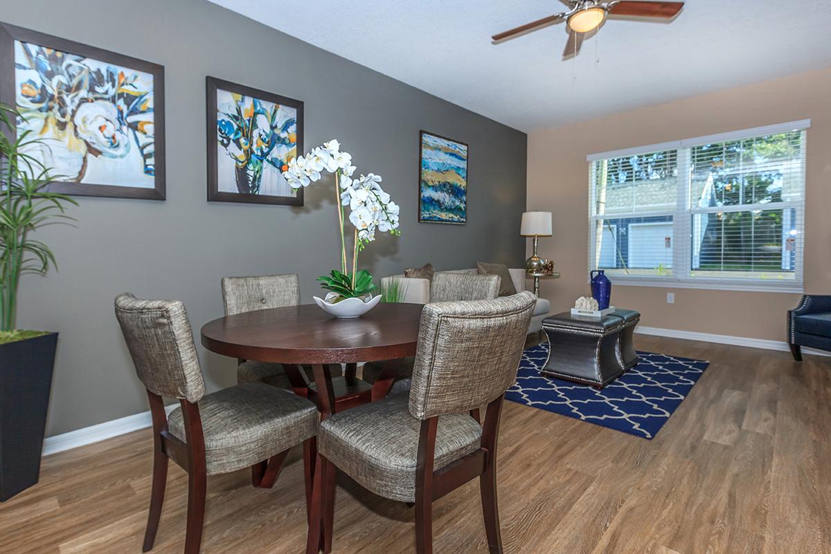 a living room filled with furniture and a large window