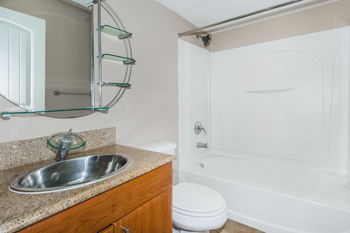 a kitchen with a sink and a shower