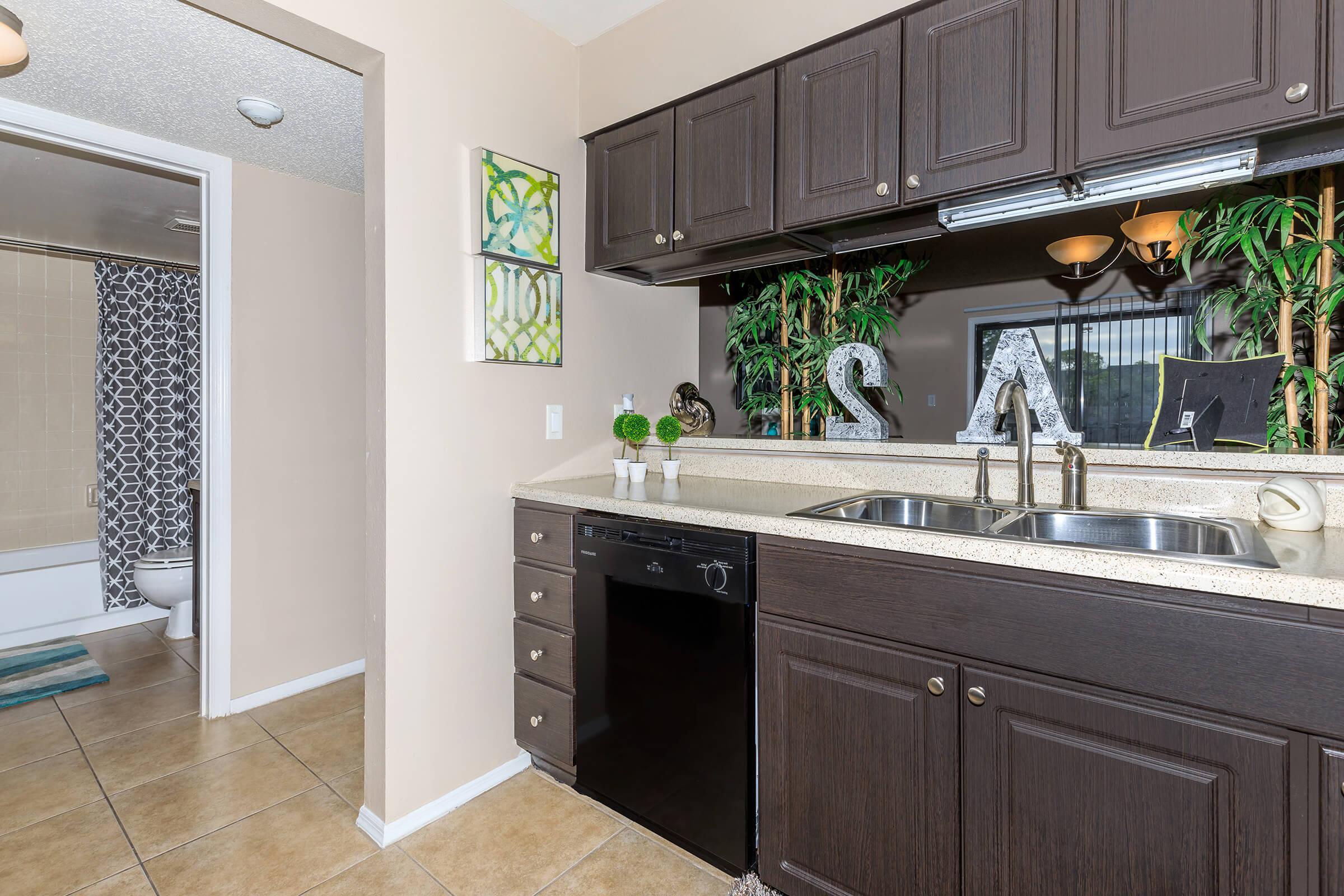 a kitchen with a sink and a window