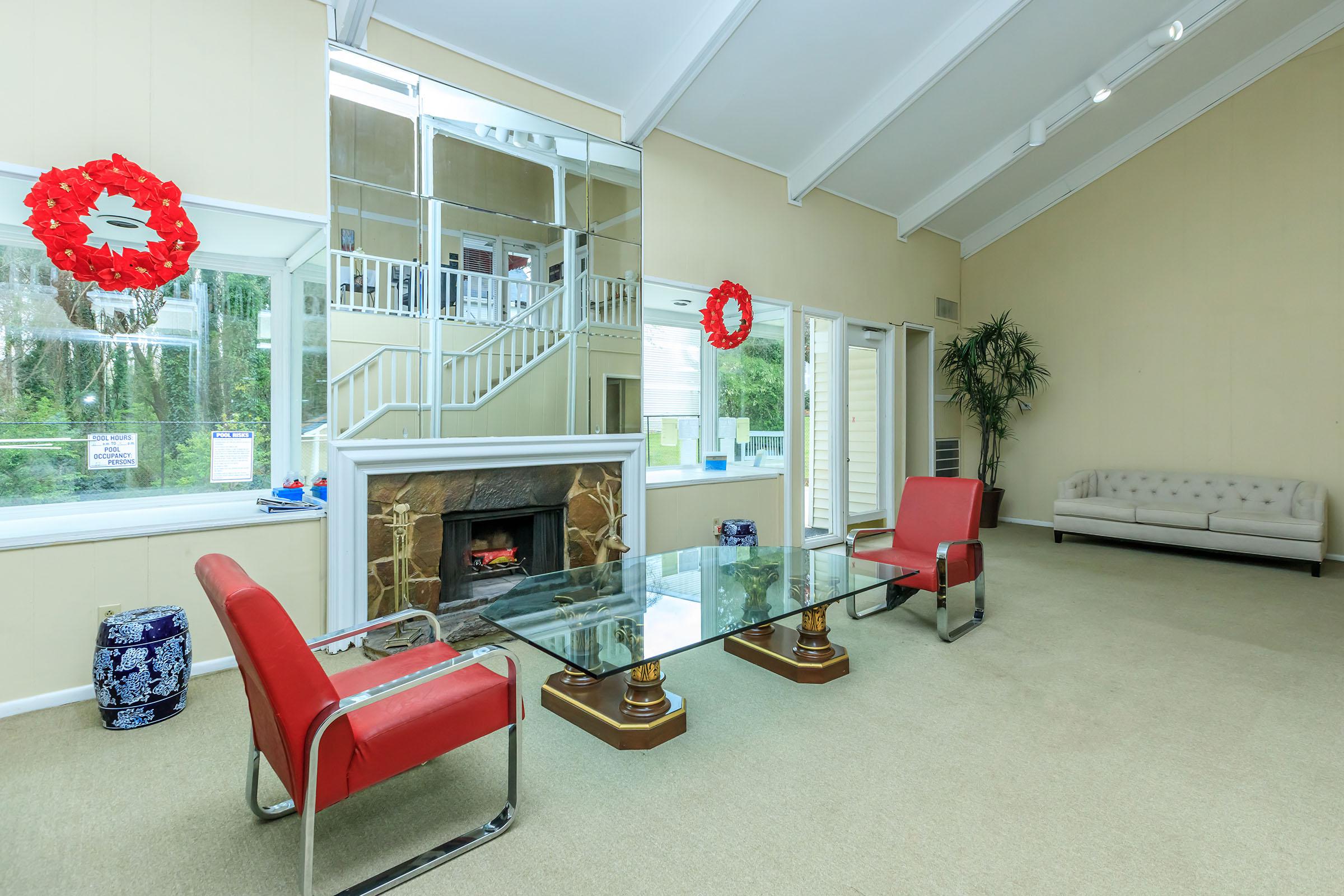 a room filled with furniture and a fire place sitting in a chair