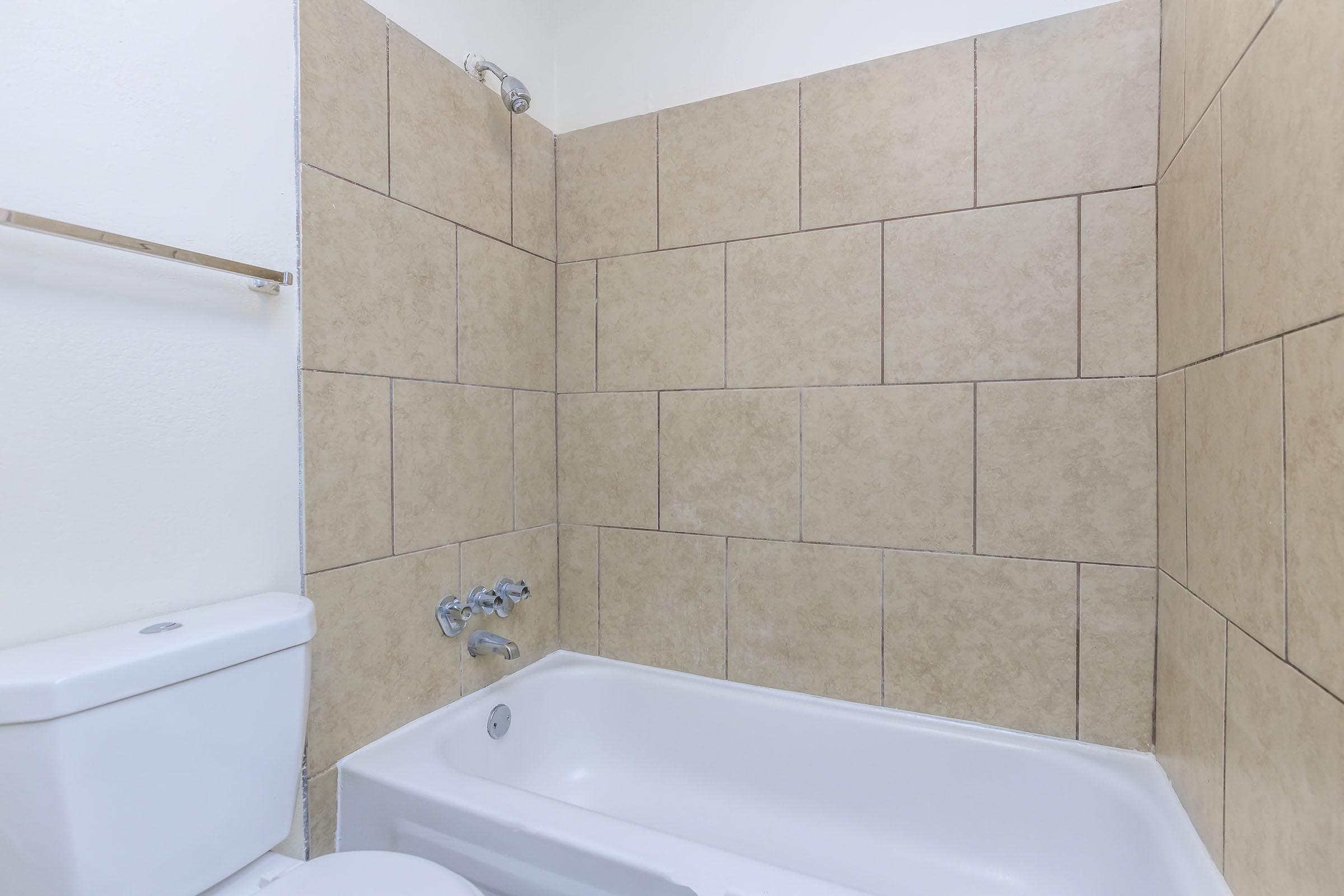 a close up of a sink and a bath tub