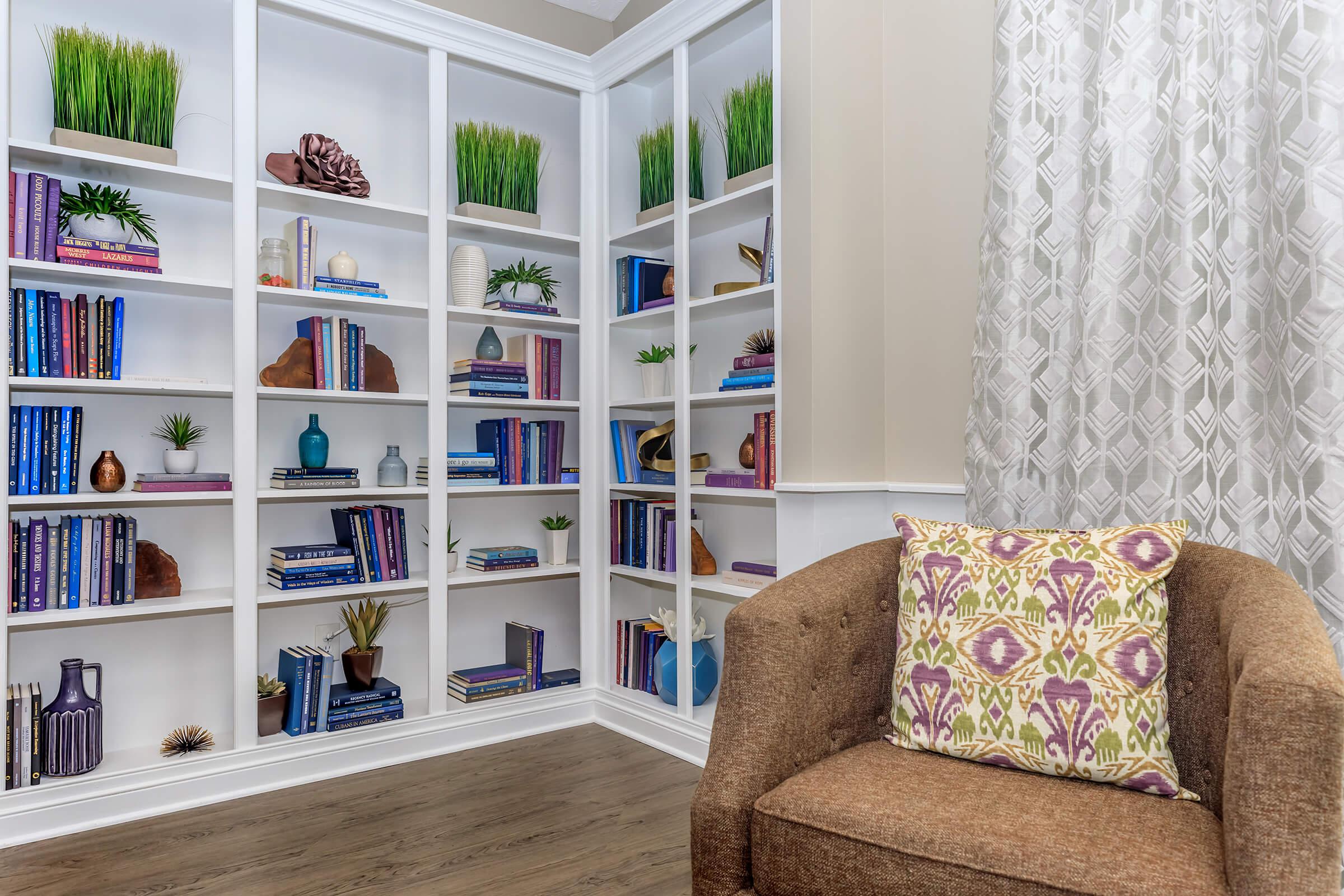 a living room with a book shelf