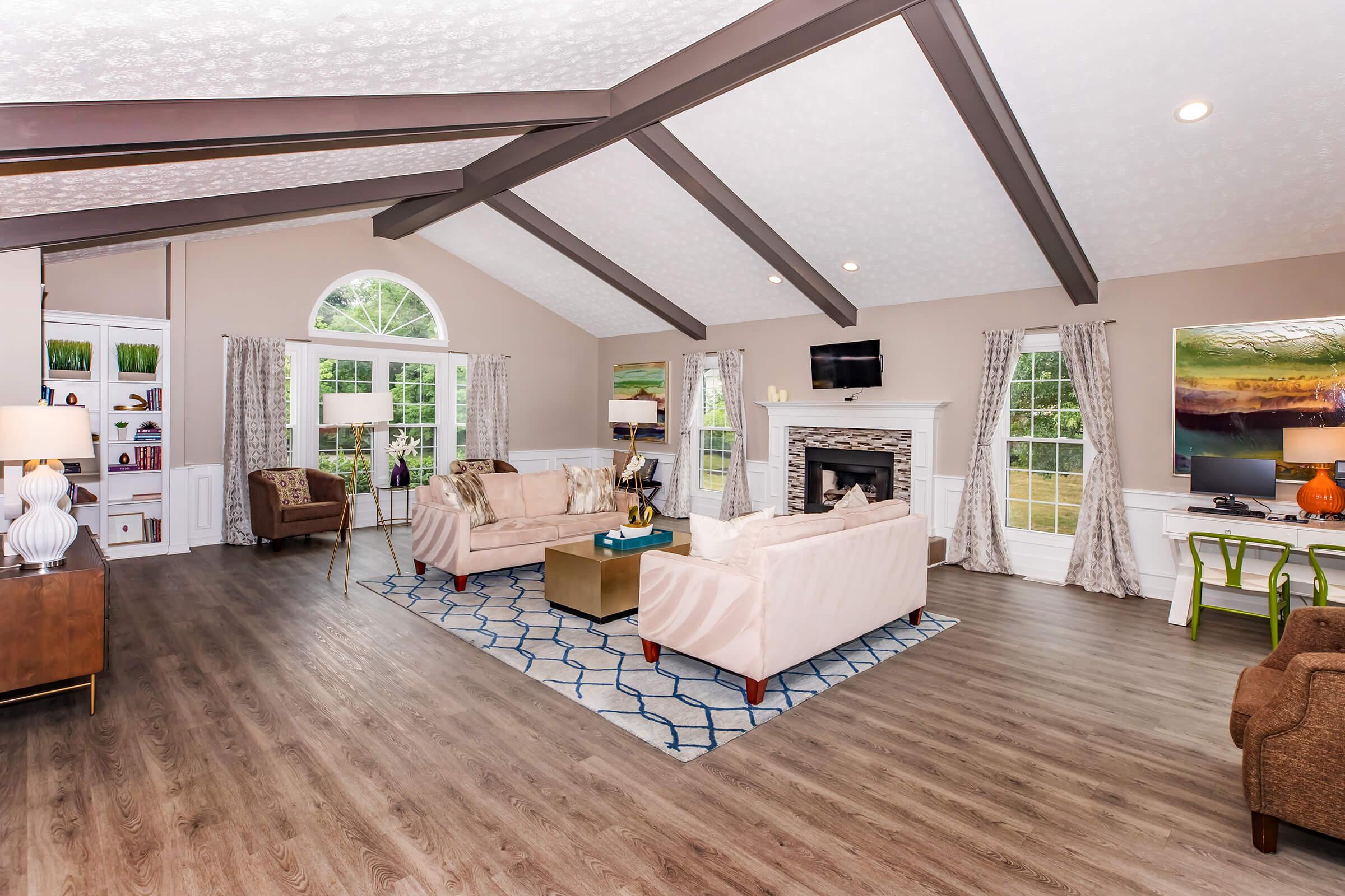 a living room filled with furniture and a fireplace