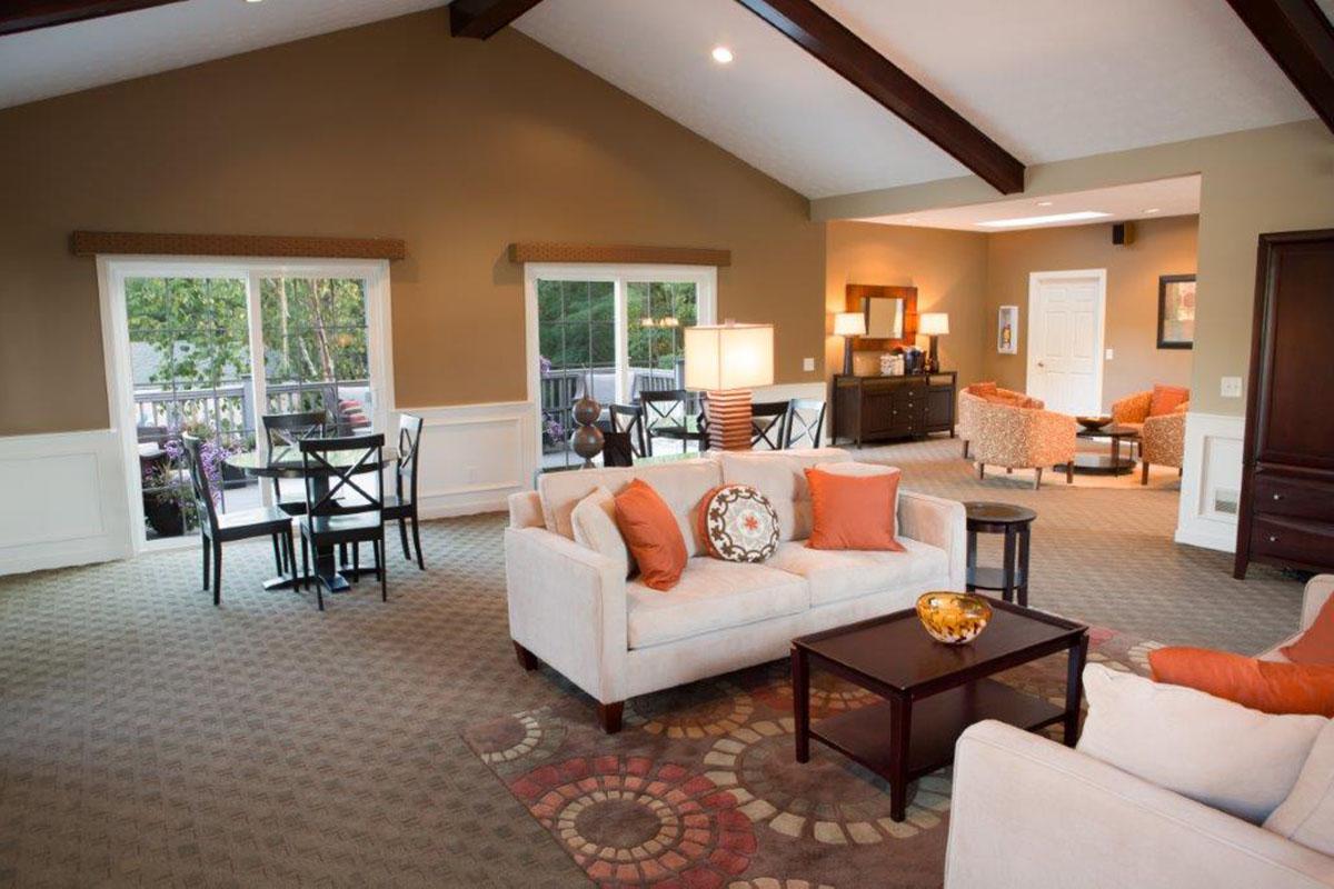 a living room filled with furniture and a fireplace