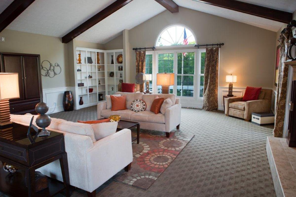 a living room filled with furniture and a fire place