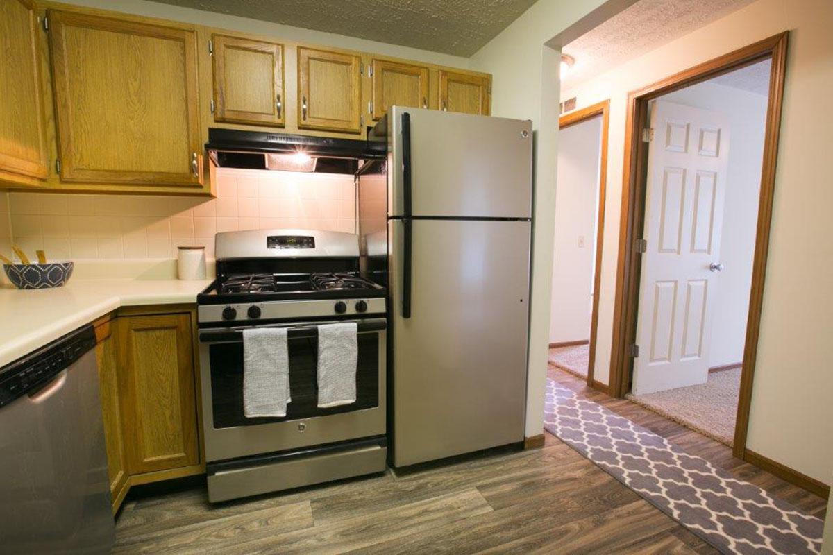 a stove top oven sitting inside of a kitchen