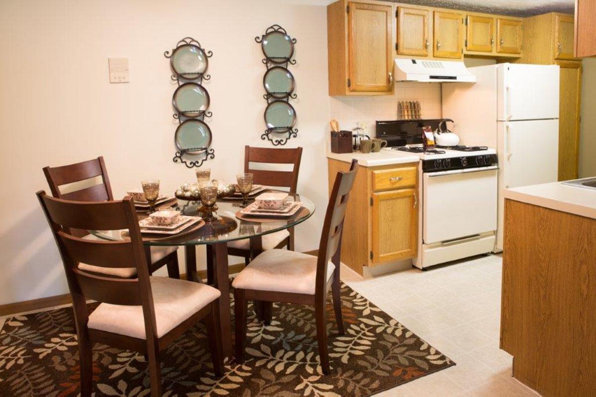 a kitchen with a dining room table
