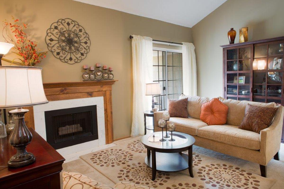 a living room filled with furniture and a fire place