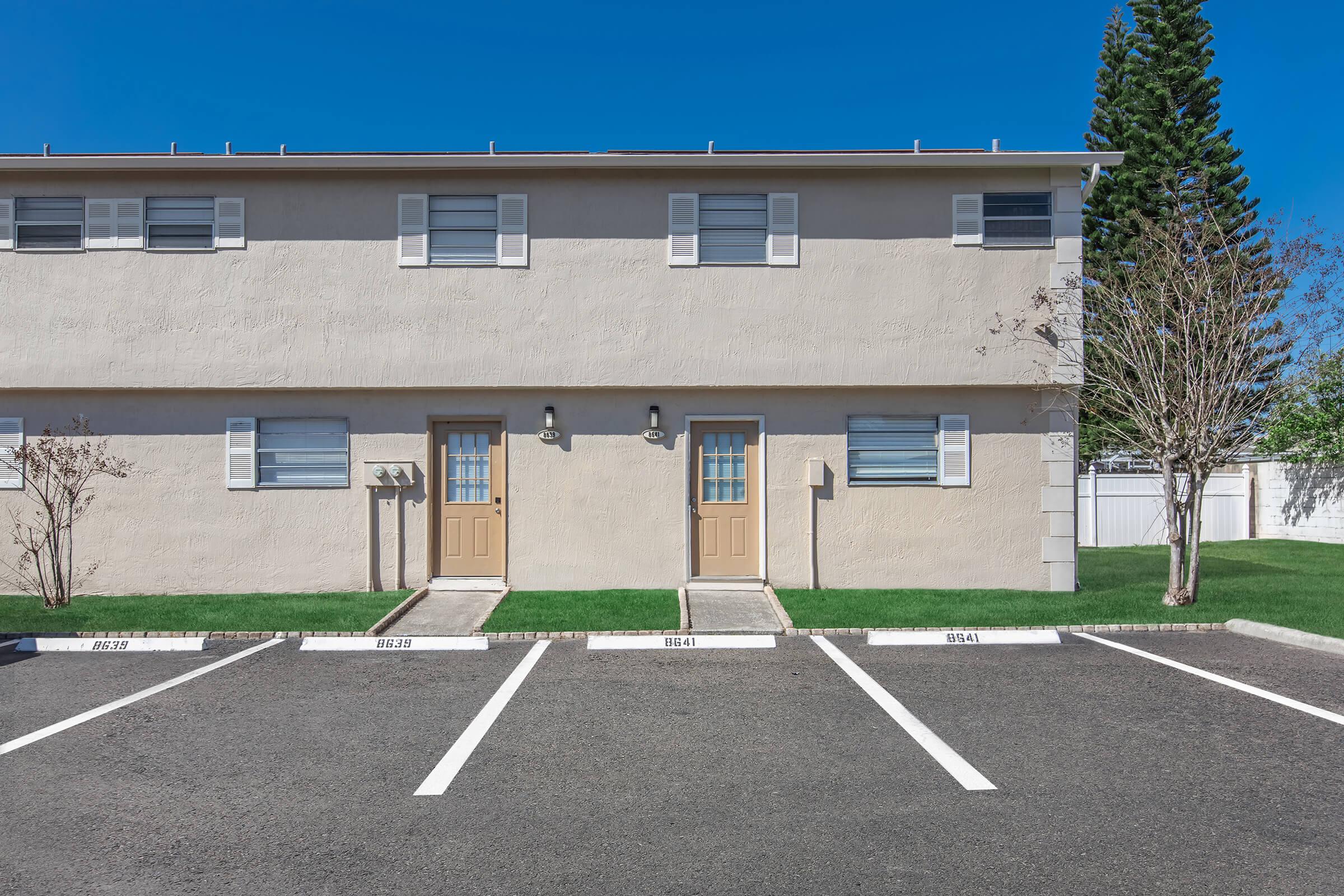 an empty parking lot in front of a building