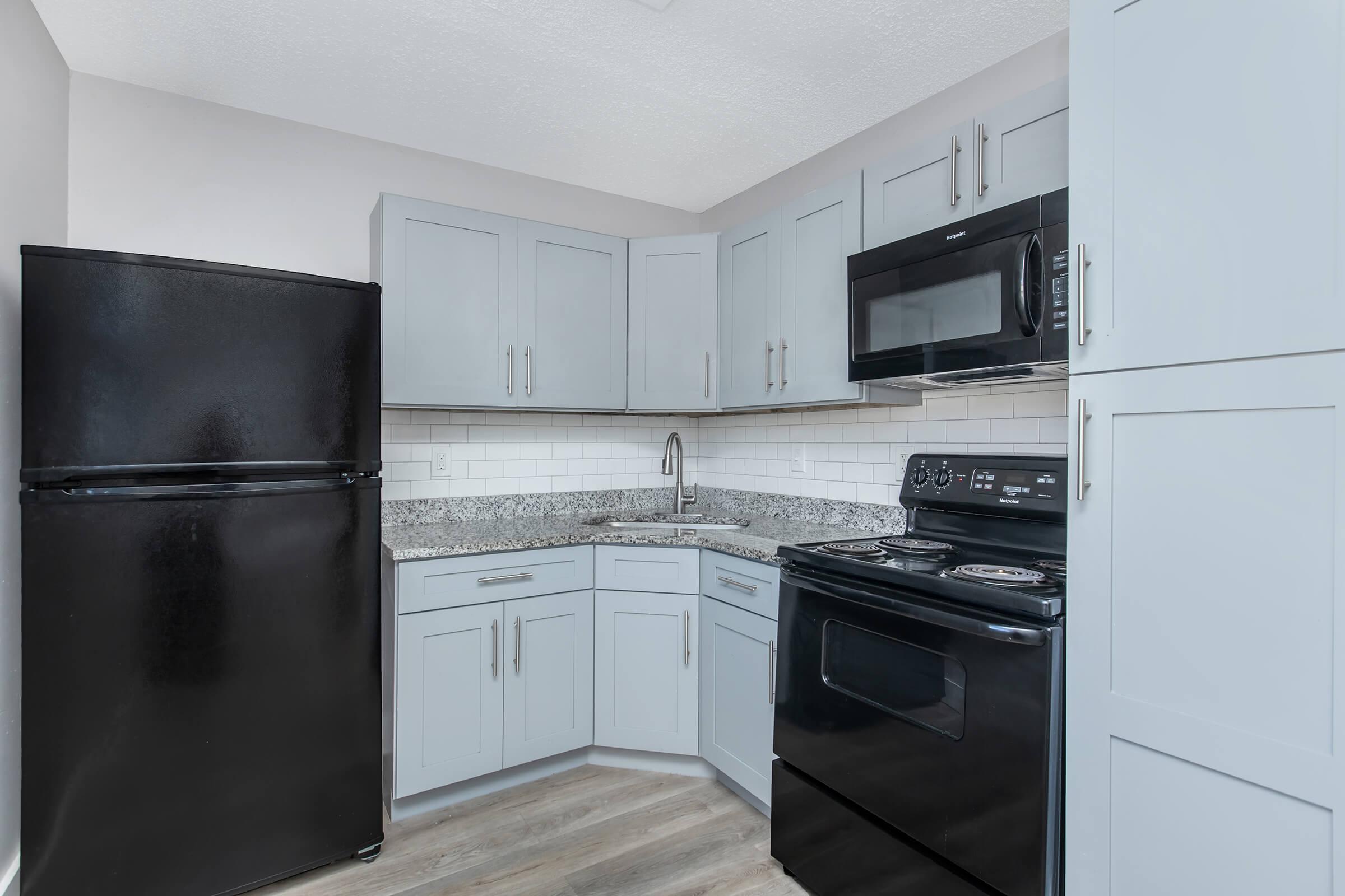 a kitchen with a stove top oven sitting inside of a refrigerator