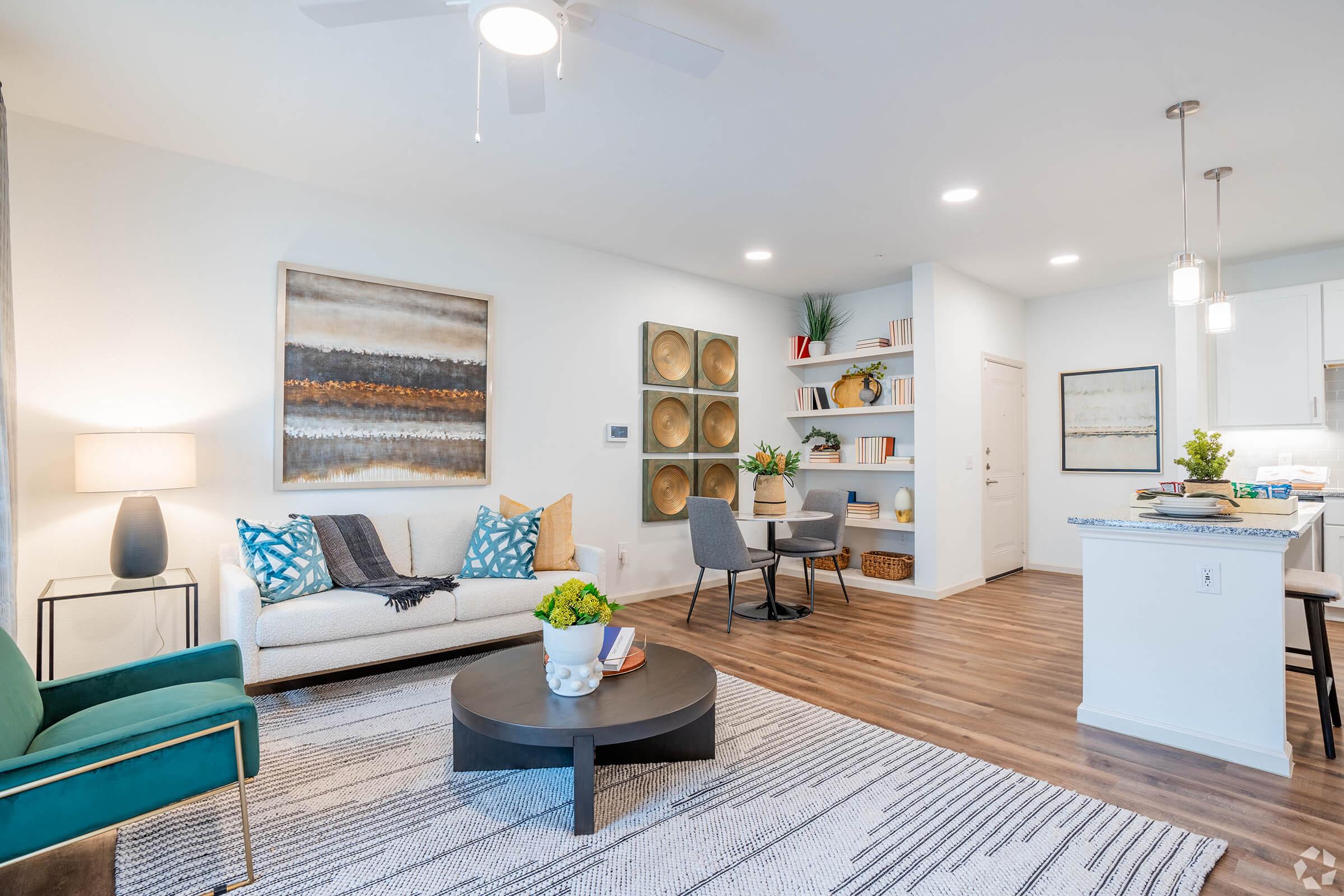 a living room filled with furniture and a fireplace