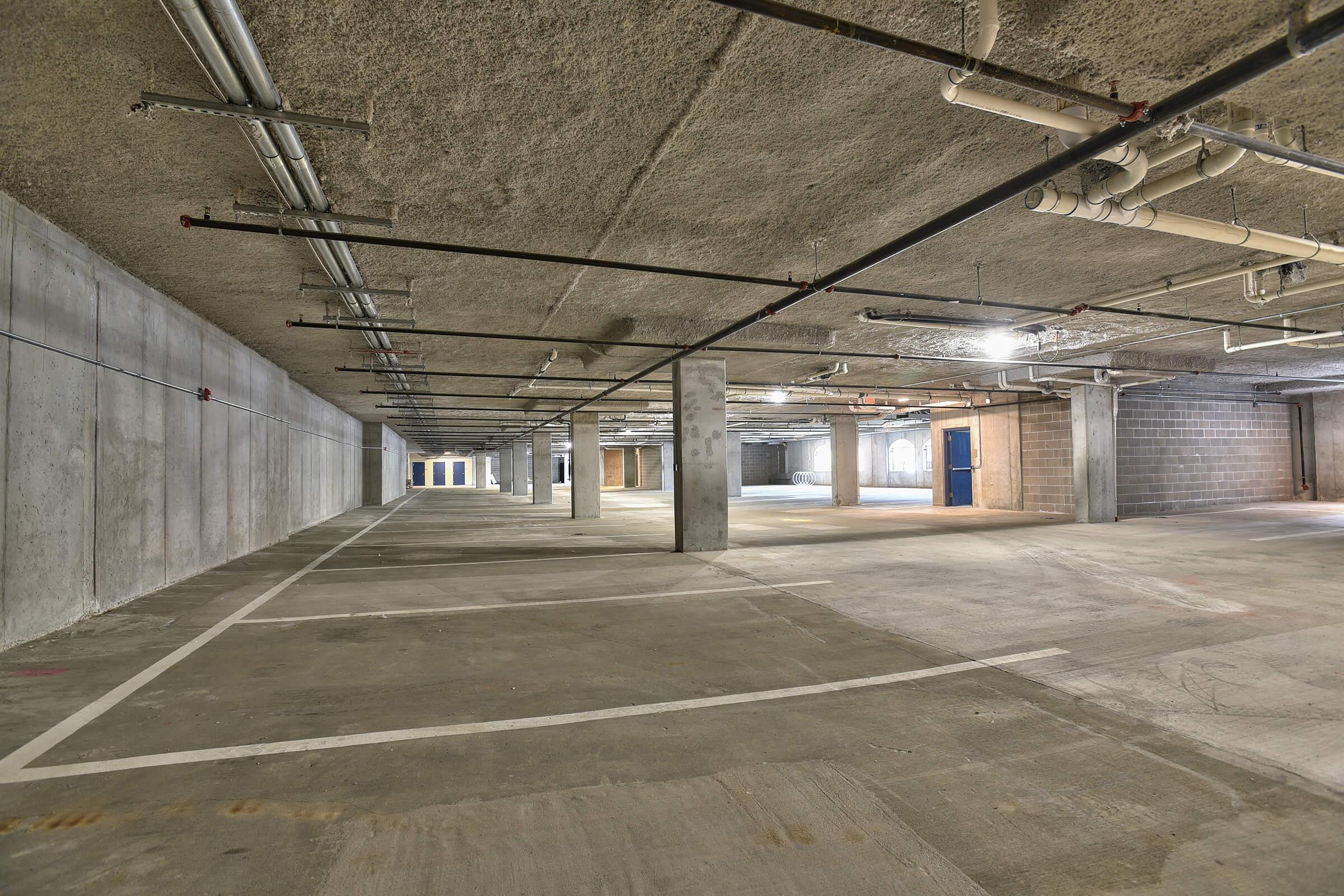 an empty road with a building in the background