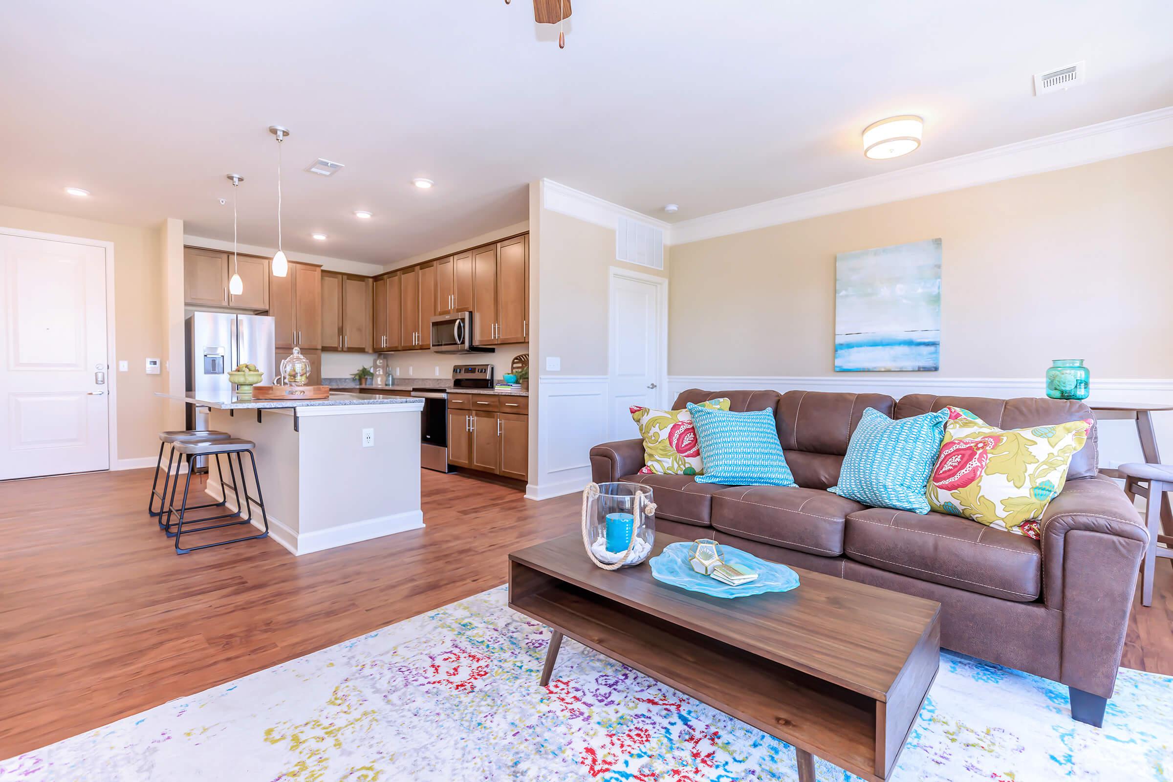 a living room filled with furniture and a flat screen tv