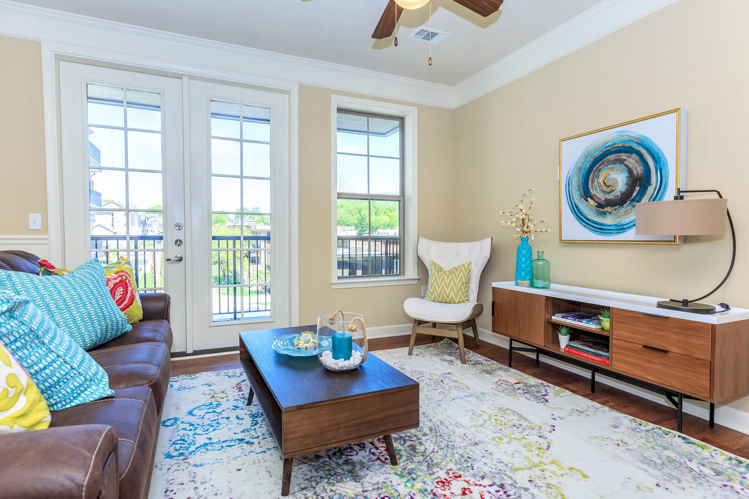 a living room filled with furniture and a fire place