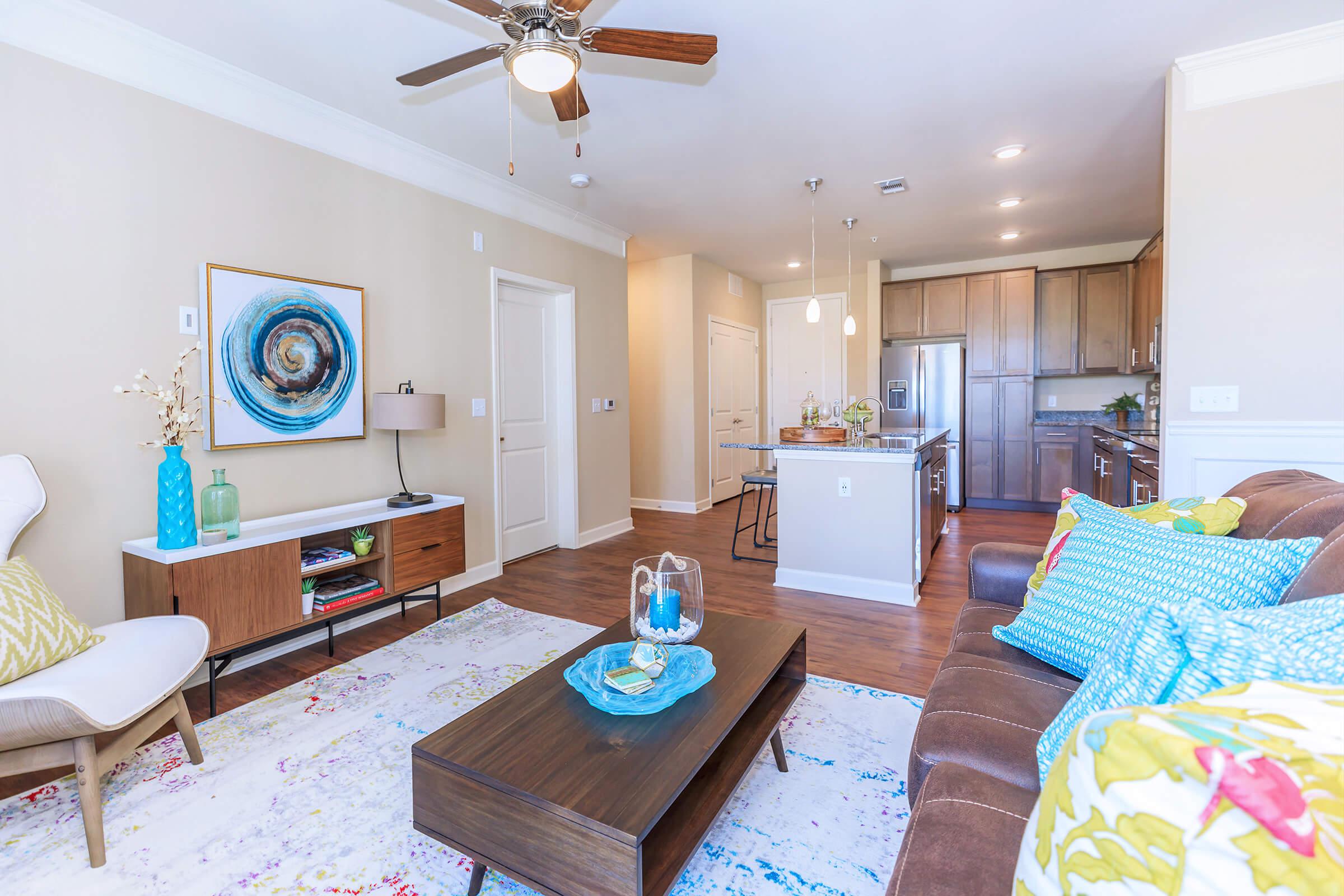 a living room filled with furniture and a fireplace