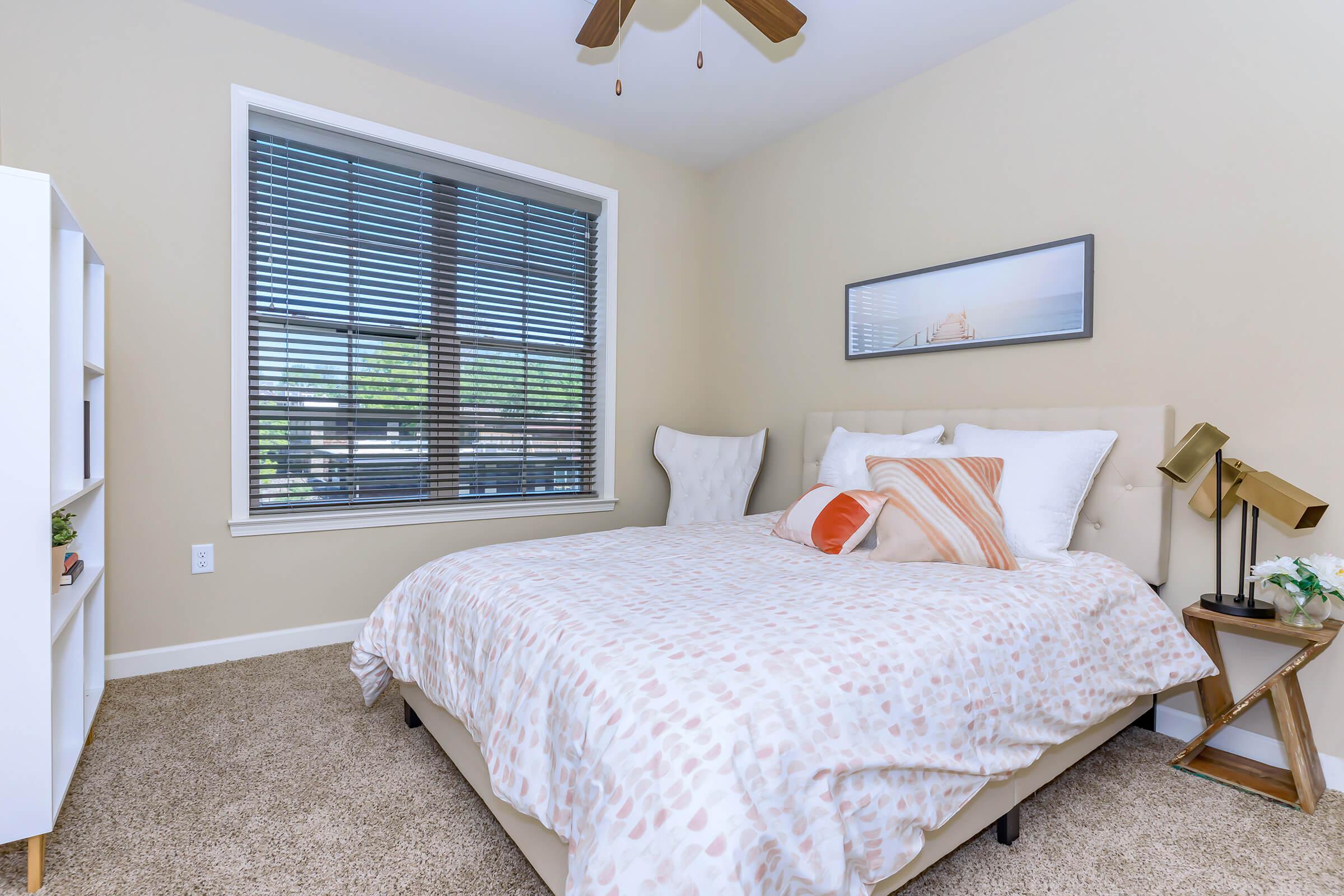 a bedroom with a large bed in a room