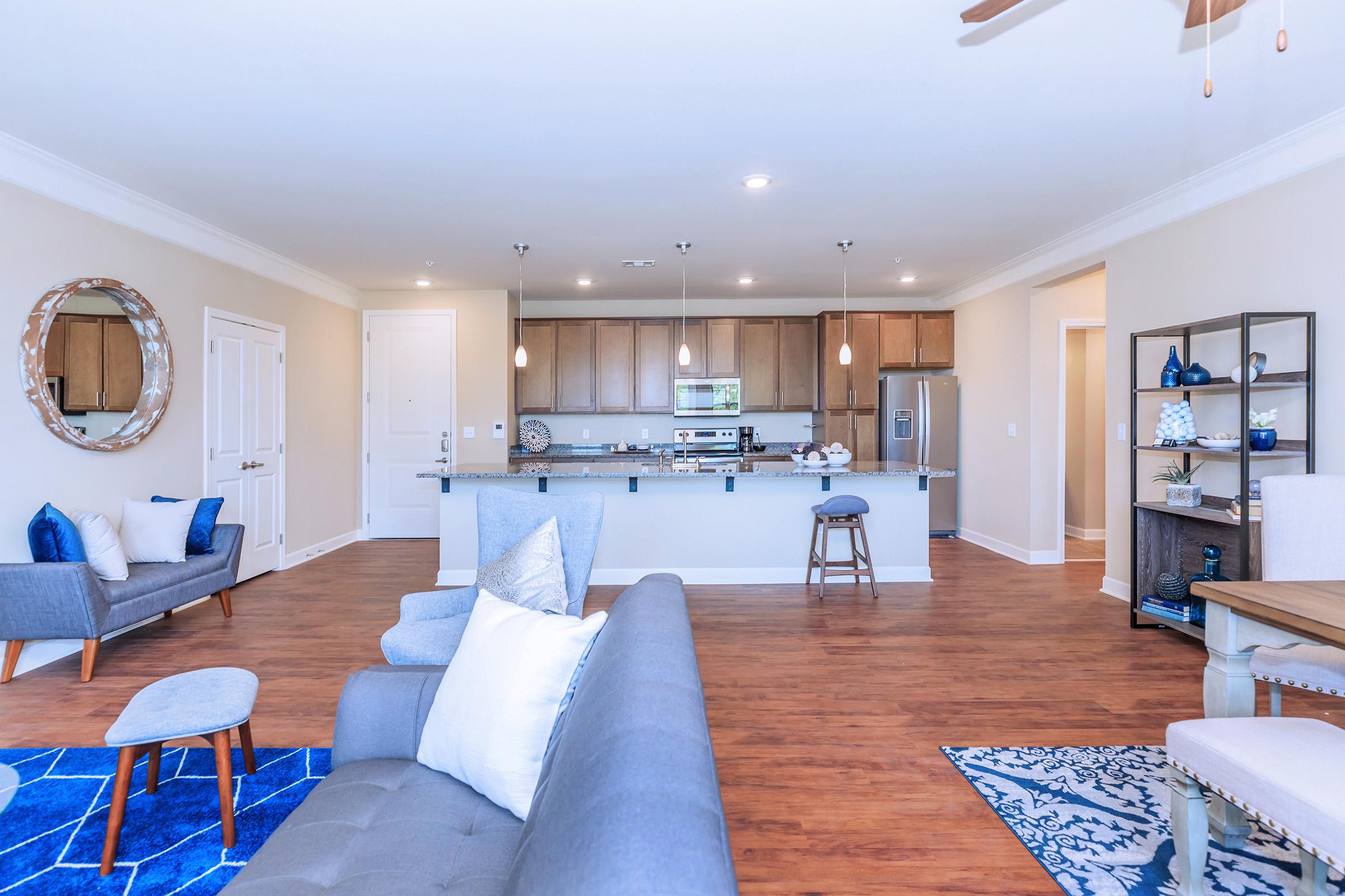 a living room filled with furniture and a table