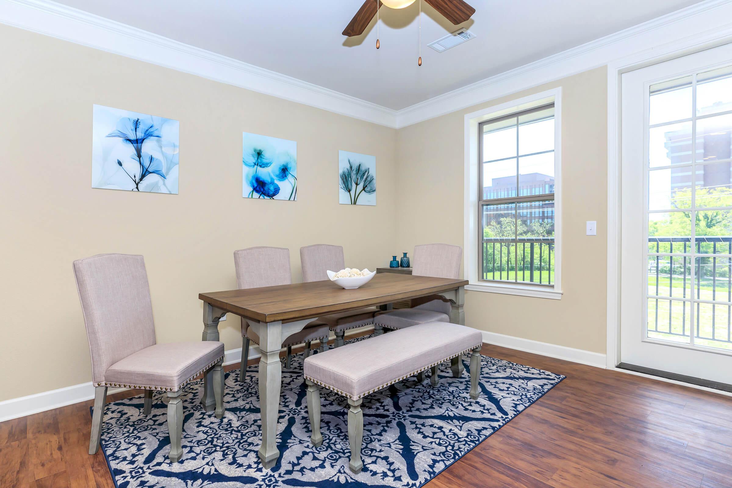 a living room filled with furniture and a large window